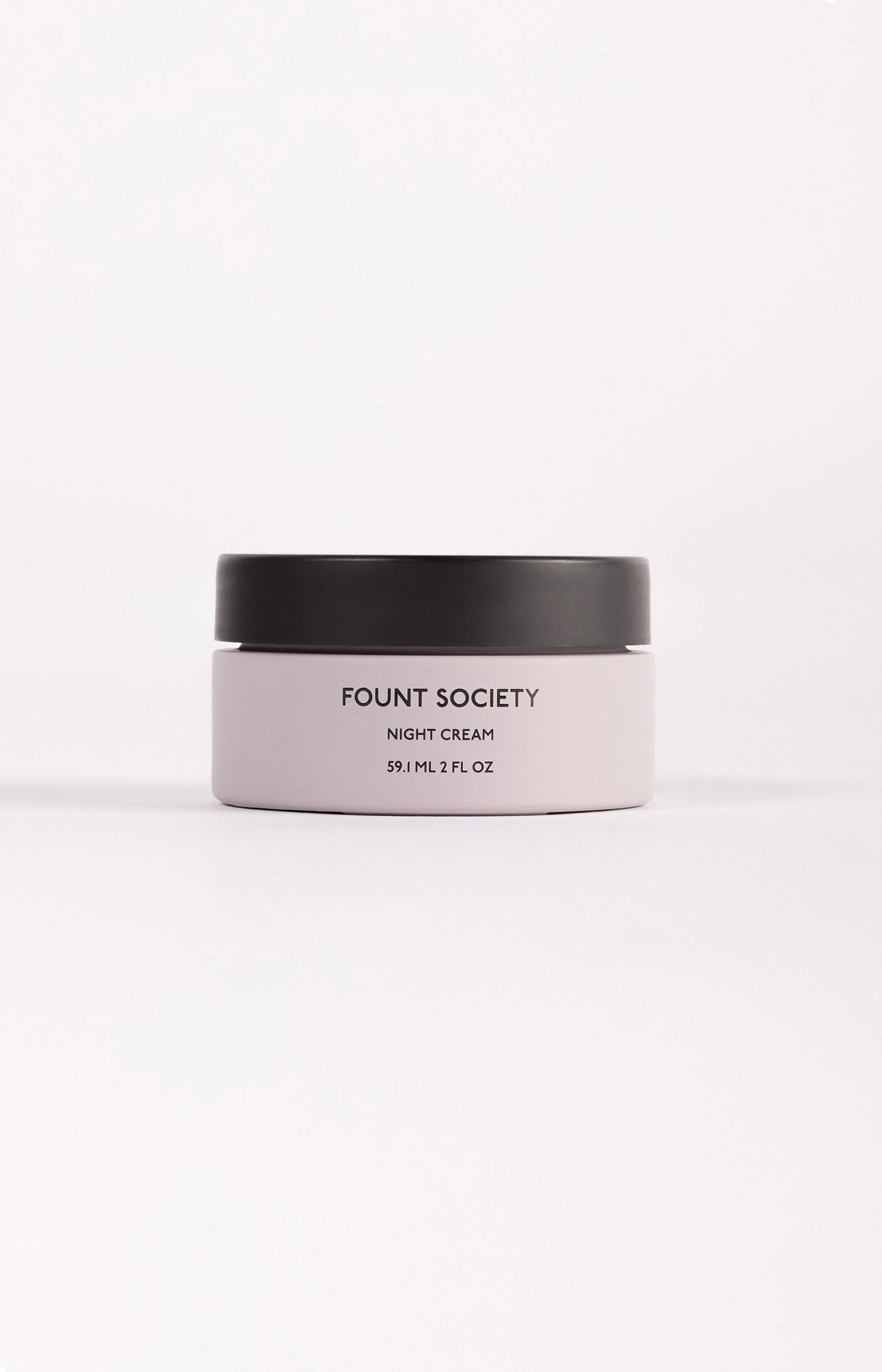 The Fount Society Night Cream container sits in front of a white background. |Size:2 OZ