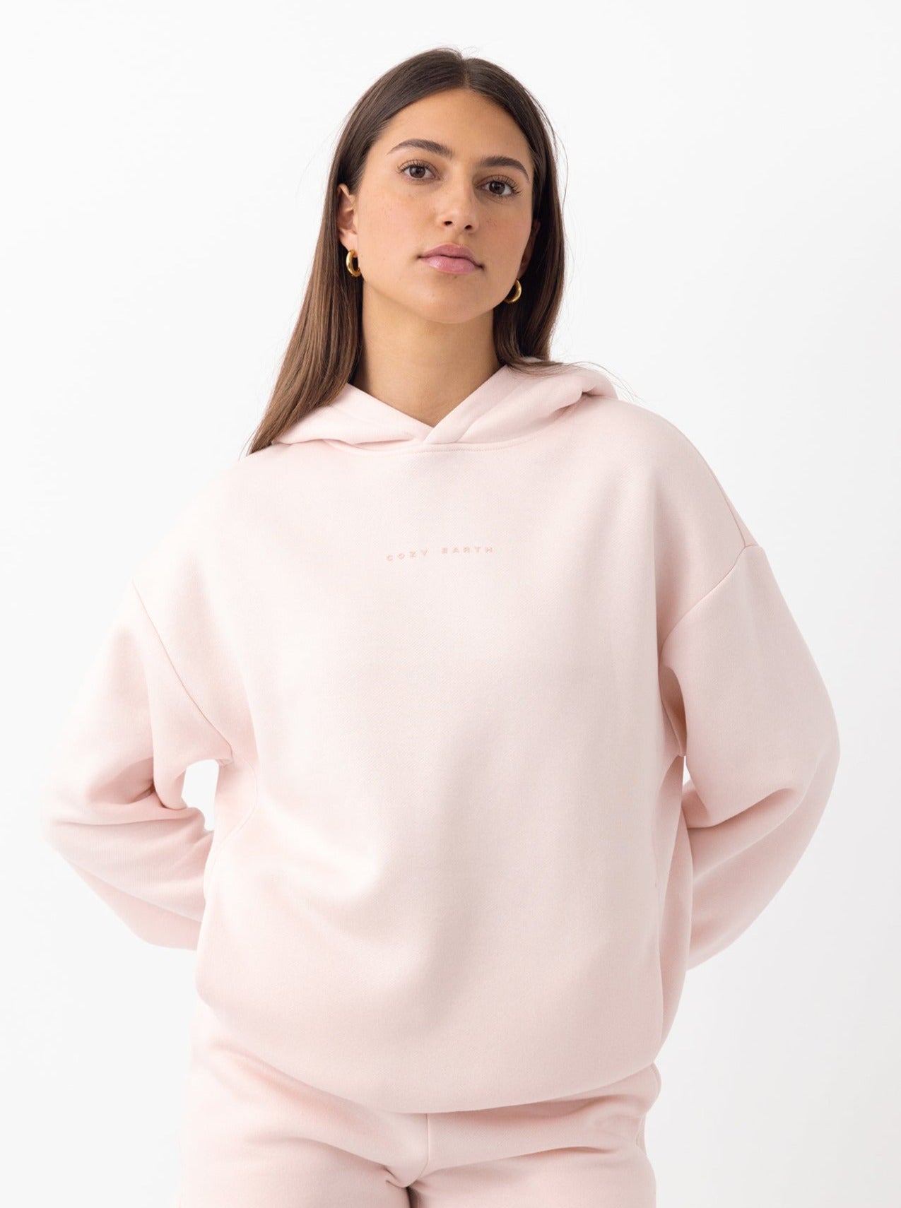 Woman in peony cityscape hoodie with white background 