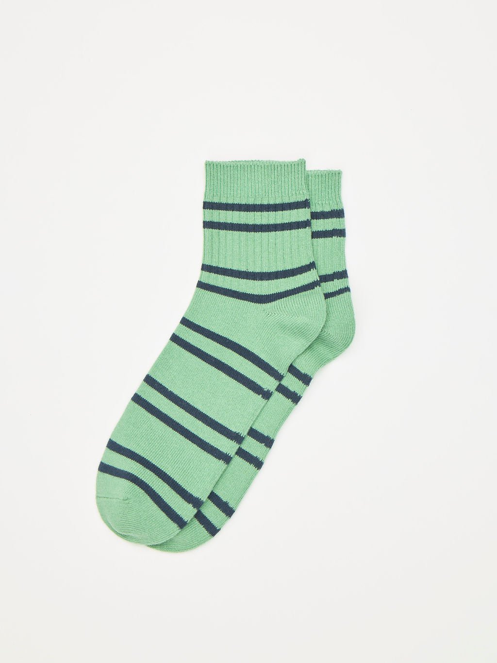 The Women's Sadie Sock by Cozy Earth features dark blue horizontal stripes on green, displayed against a plain white background. These socks have ribbed cuffs and a simple, casual design. 