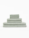 A stack of Nantucket Bath Towels sit in front of a white background. |Color:Heathered Sage