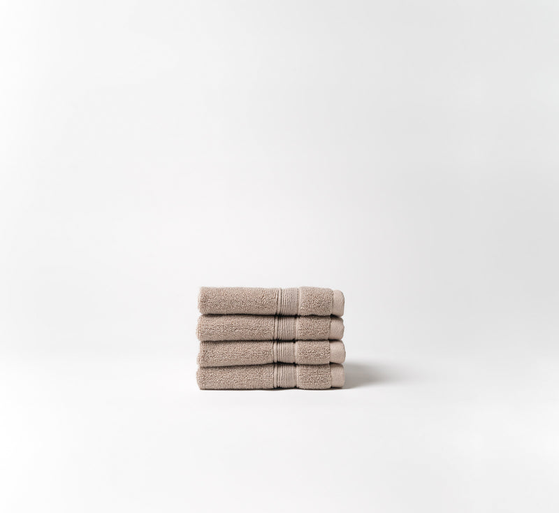 Sand washcloths folded with white background