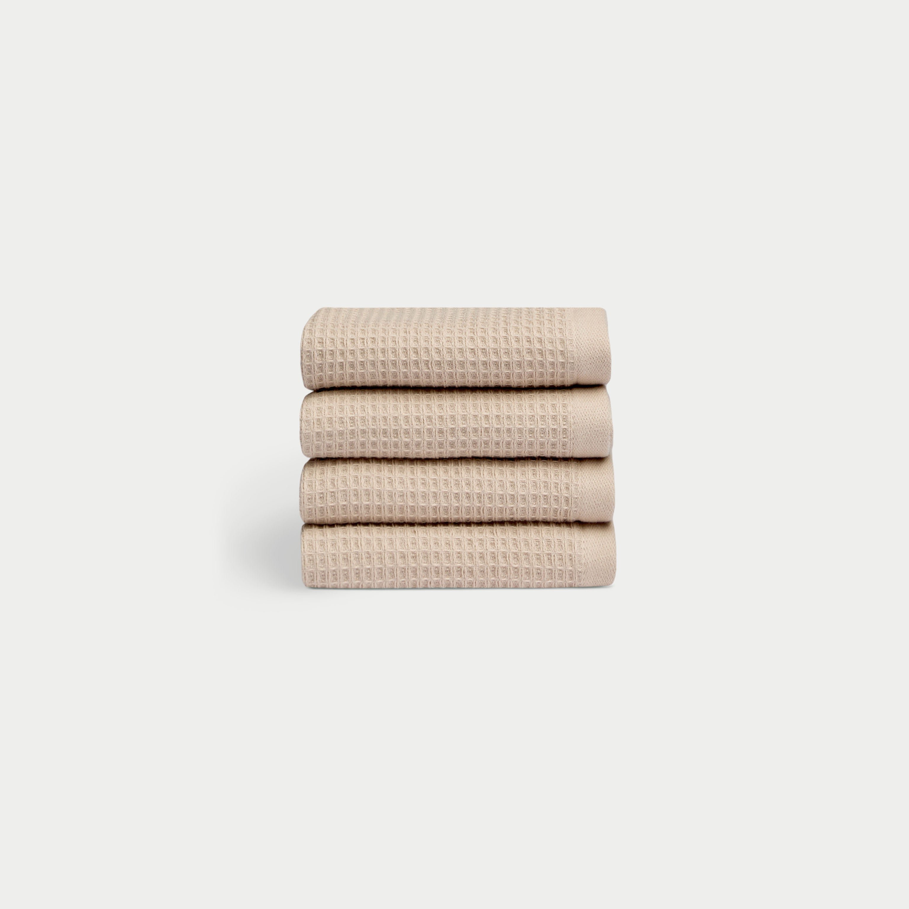 Sand Waffle Wash Cloths neatly folded. The photo was taken with a white background. 