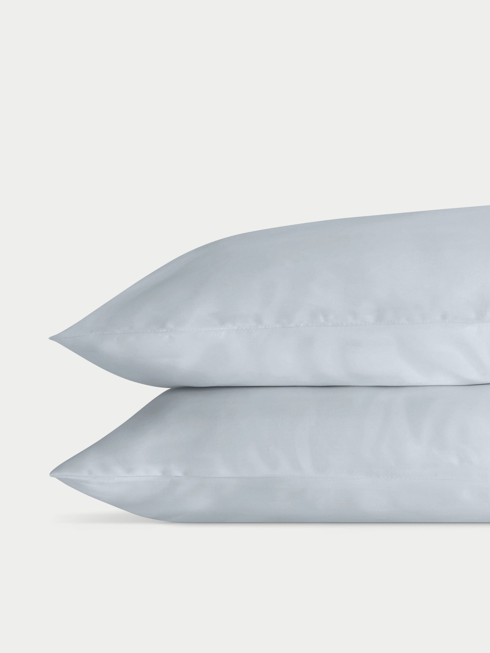 Two shore pillowcases with a plain background standard/king/body