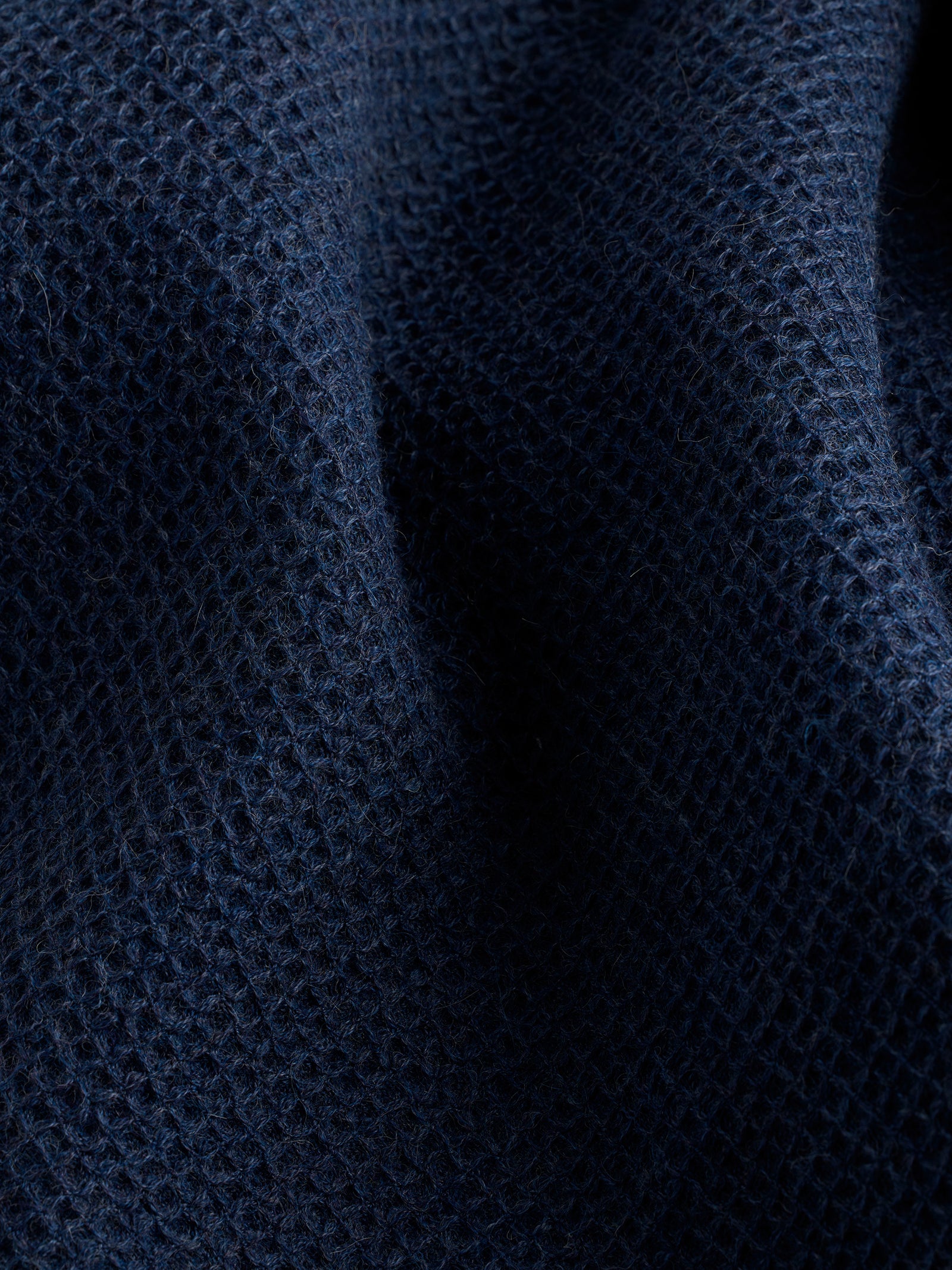 Close up of slate blue alpaca throw 