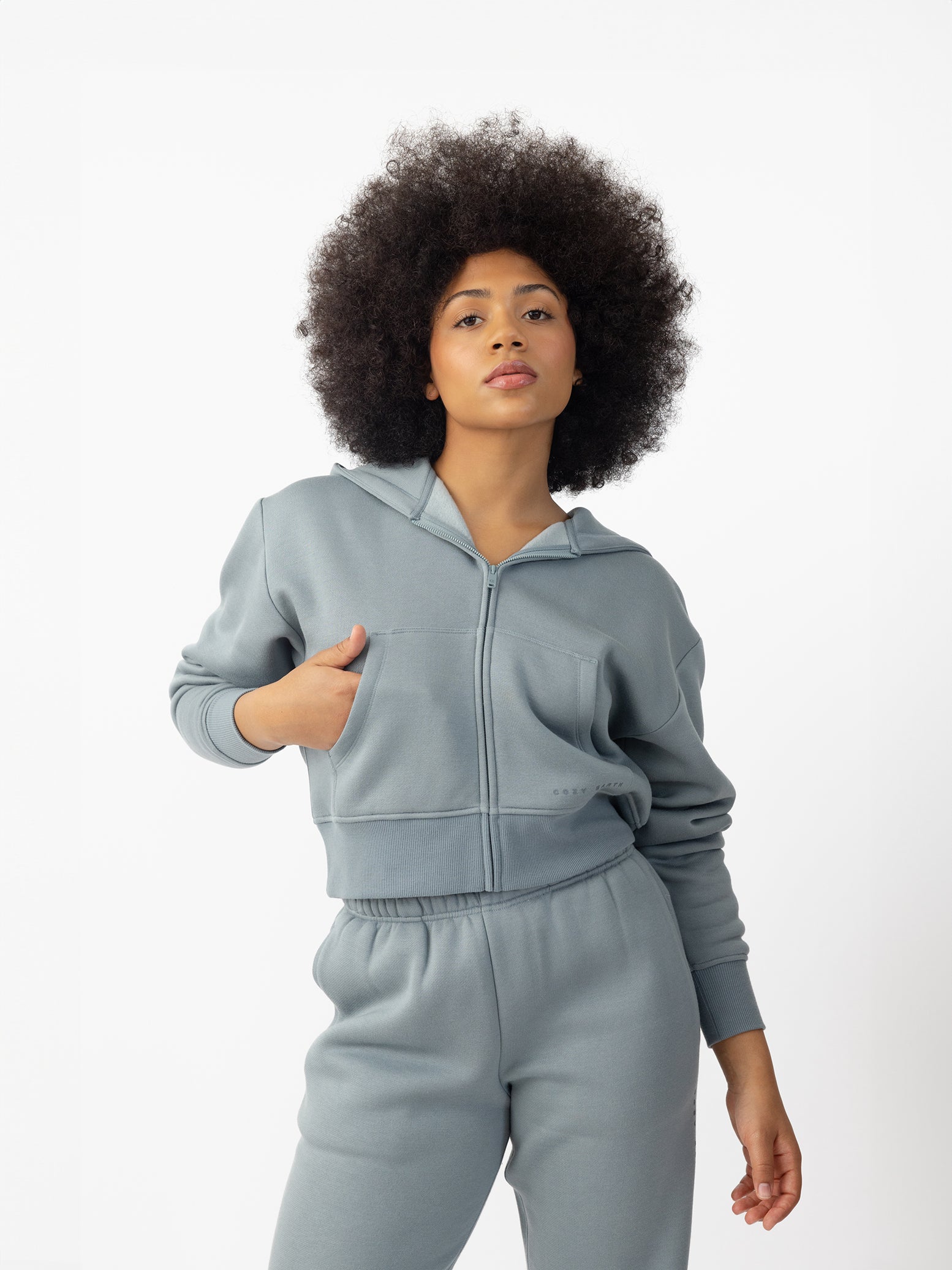  Woman wearing Smokey Blue  CityScape Cropped Full Zip with white background 