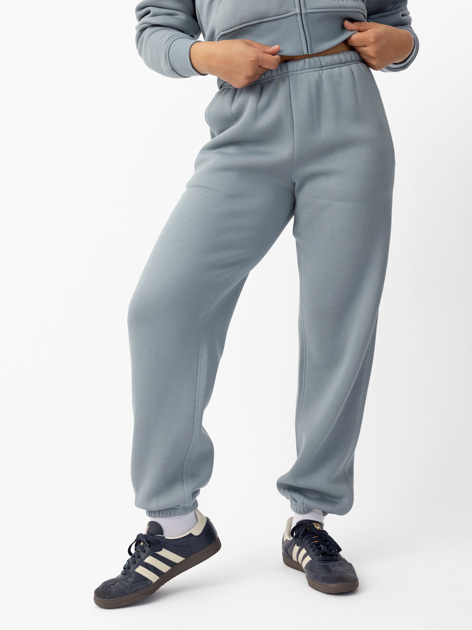  Woman wearing Smokey Blue CityScape Sweat Pant with white background |Color: Smokey Blue