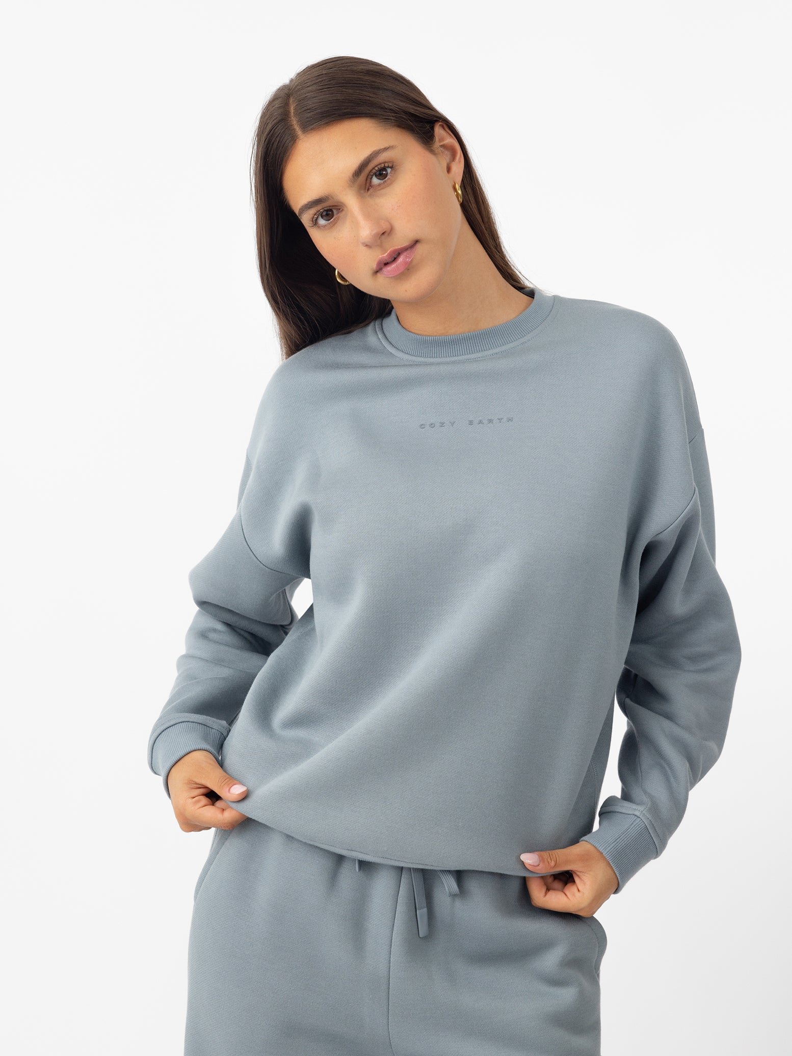 Woman wearing Smokey Blue CityScape Crewneck with white background 