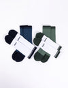 Four pairs of Cozy Earth socks are shown in the Essential Calf Sock 4-Pack. One pair is white with dark blue toes and heels, another is solid dark blue, a third pair is white with dark green toes and heels, and the fourth pair is solid dark green. |Color:Spruce/Eclipse