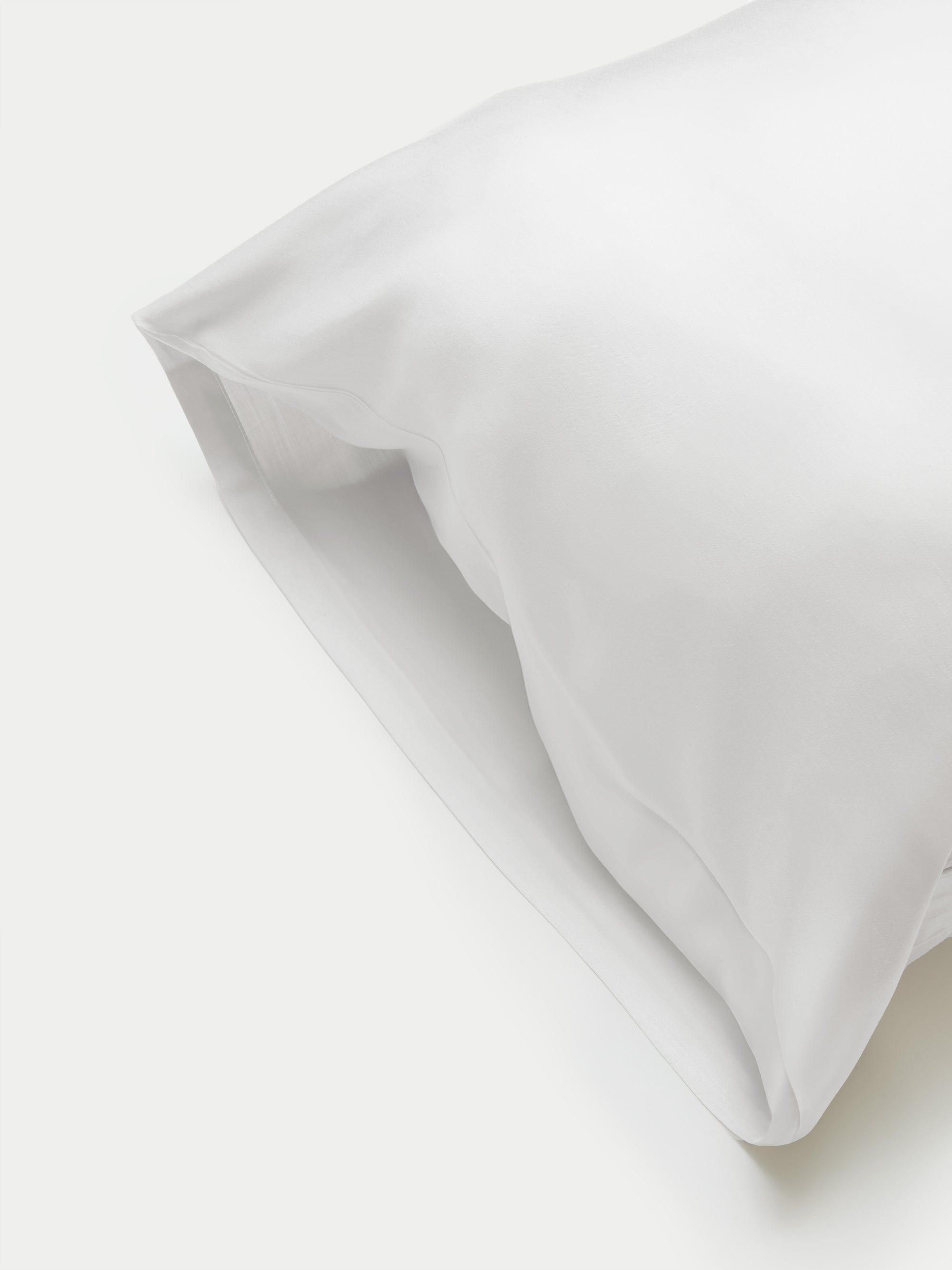 Side of white body pillowcase with plain background 