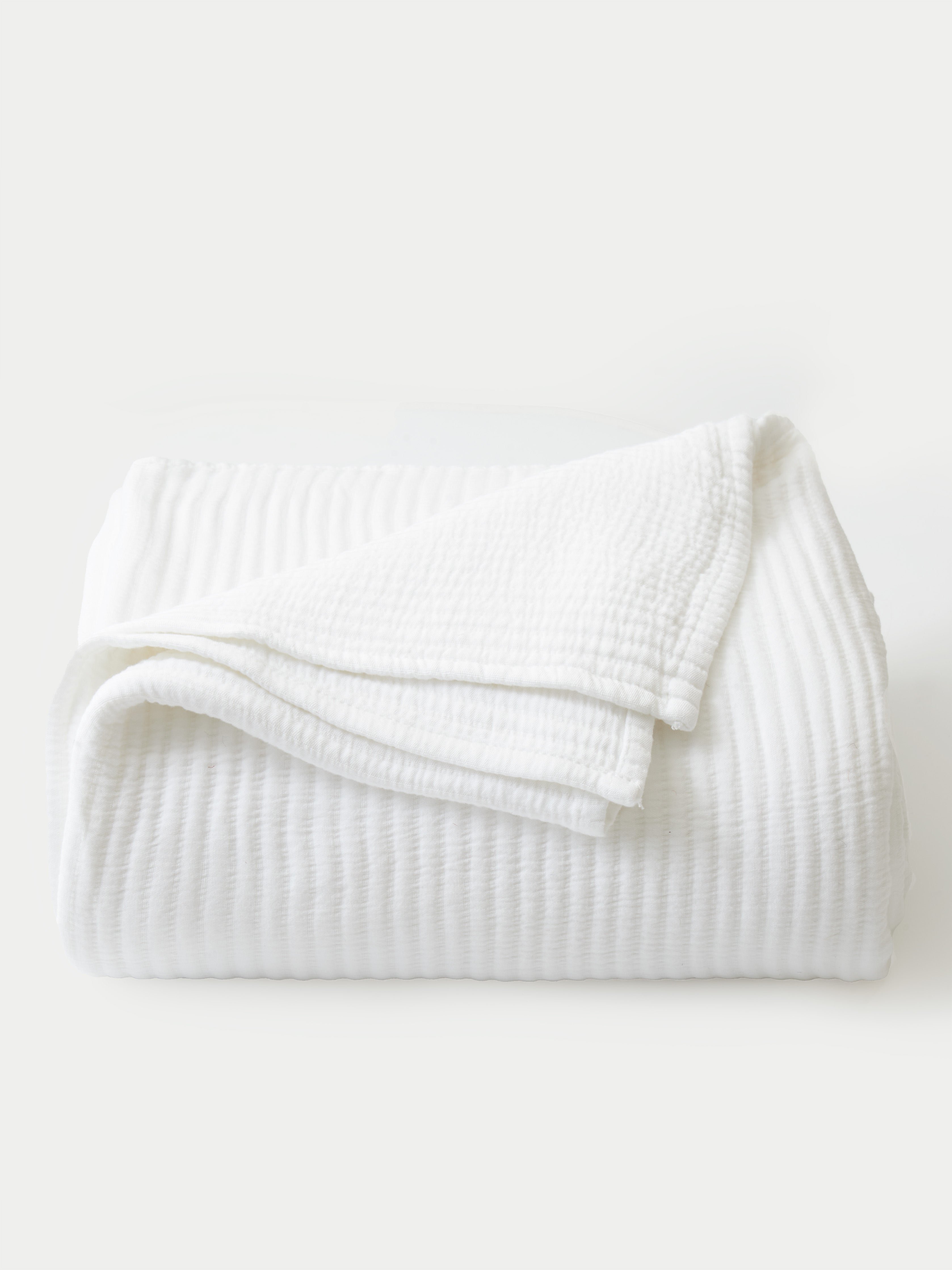 White coverlet folded with white background |Color:White