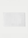 The Cozy Earth Loop Terry Bath Mat, featuring a plain white rectangular design, is displayed on a white background.|Color:White
