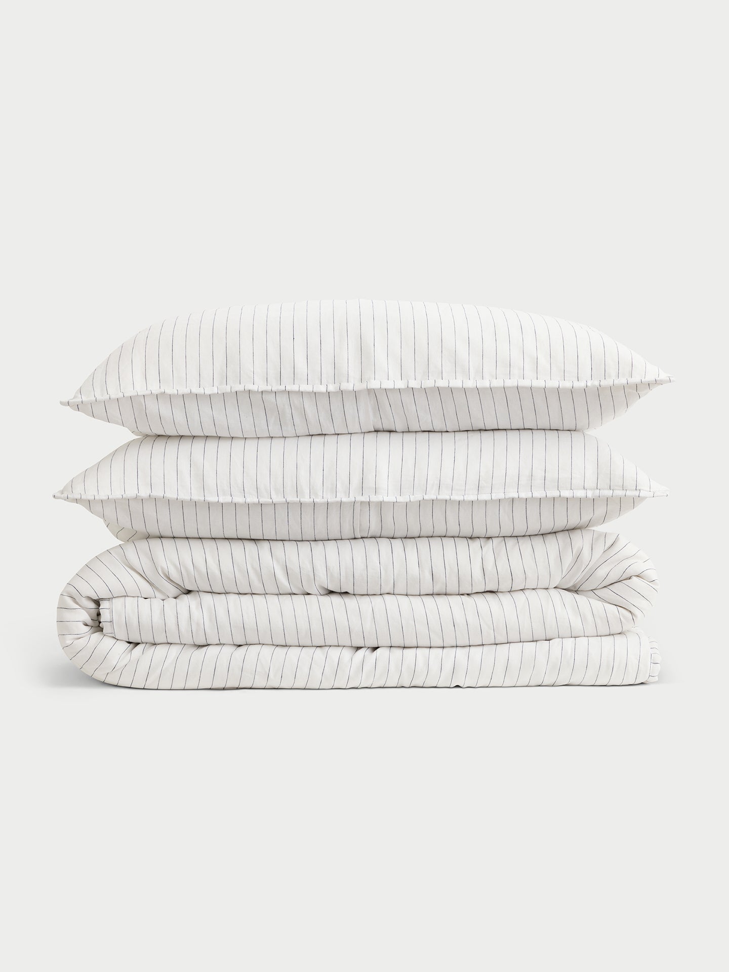 Charcoal pencil stripe quilt and shams folded with white background |Color:Charcoal/White