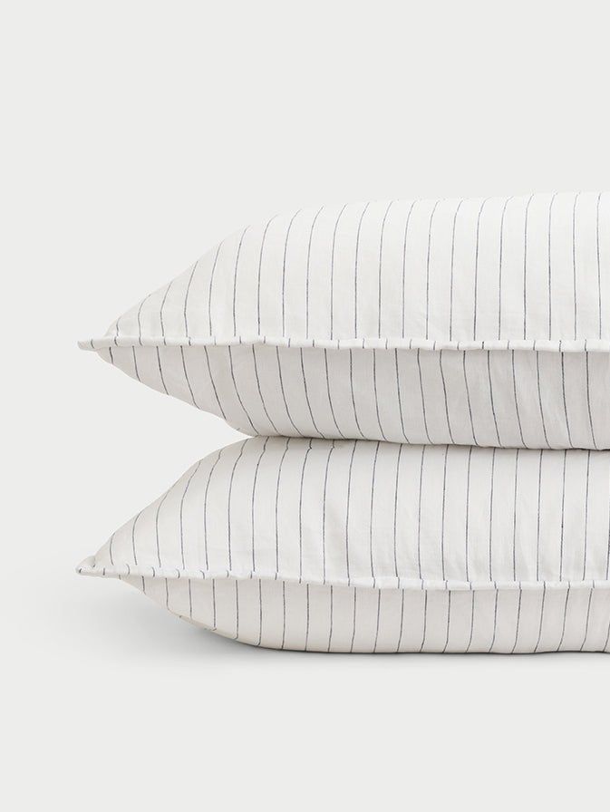 Two charcoal pencil stripe shams with white background 