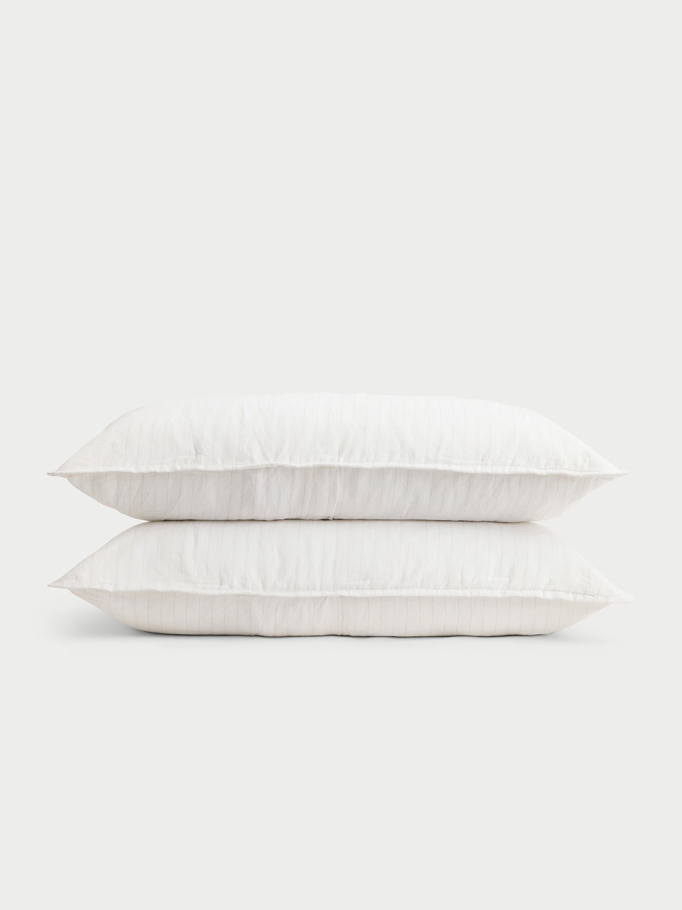 Two flax pencil stripe shams with white background 