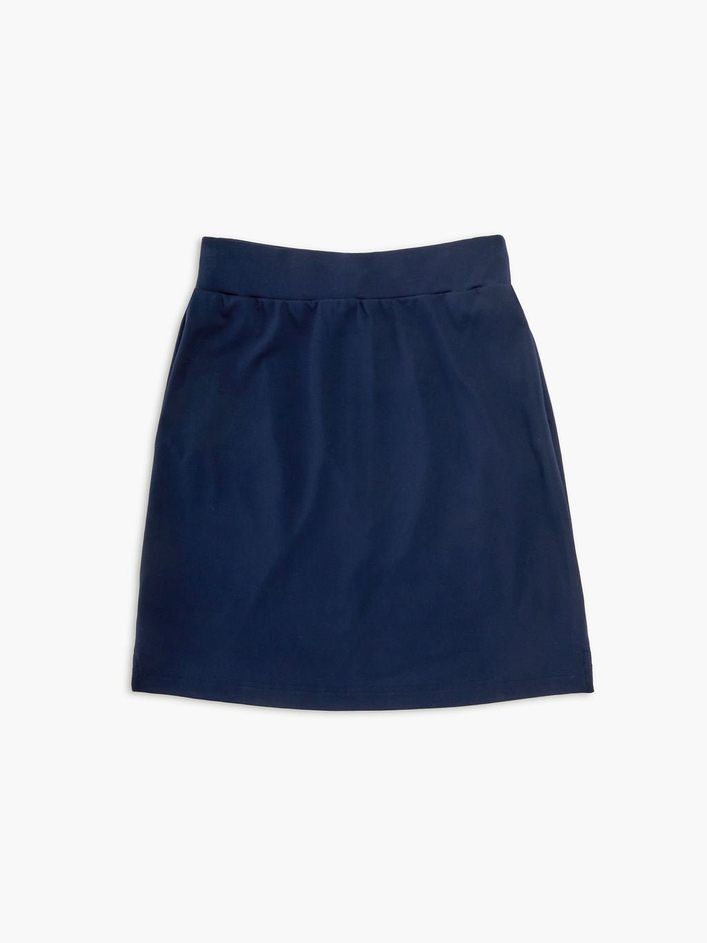 The Women's Brushed Bamboo Skirt from Cozy Earth, featuring a plain navy blue color and wide waistband, is shown on a white background. Its sleek, knee-length design highlights simplicity with no visible patterns or details. 