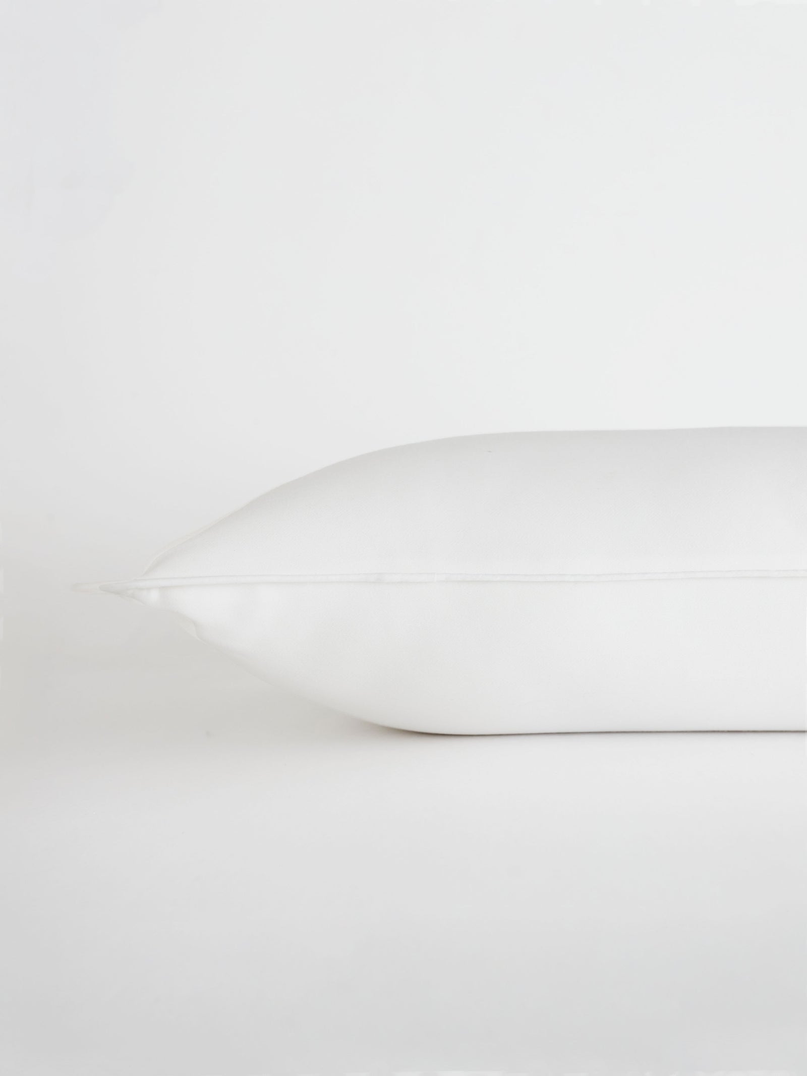 Travel size down pillow with white background 