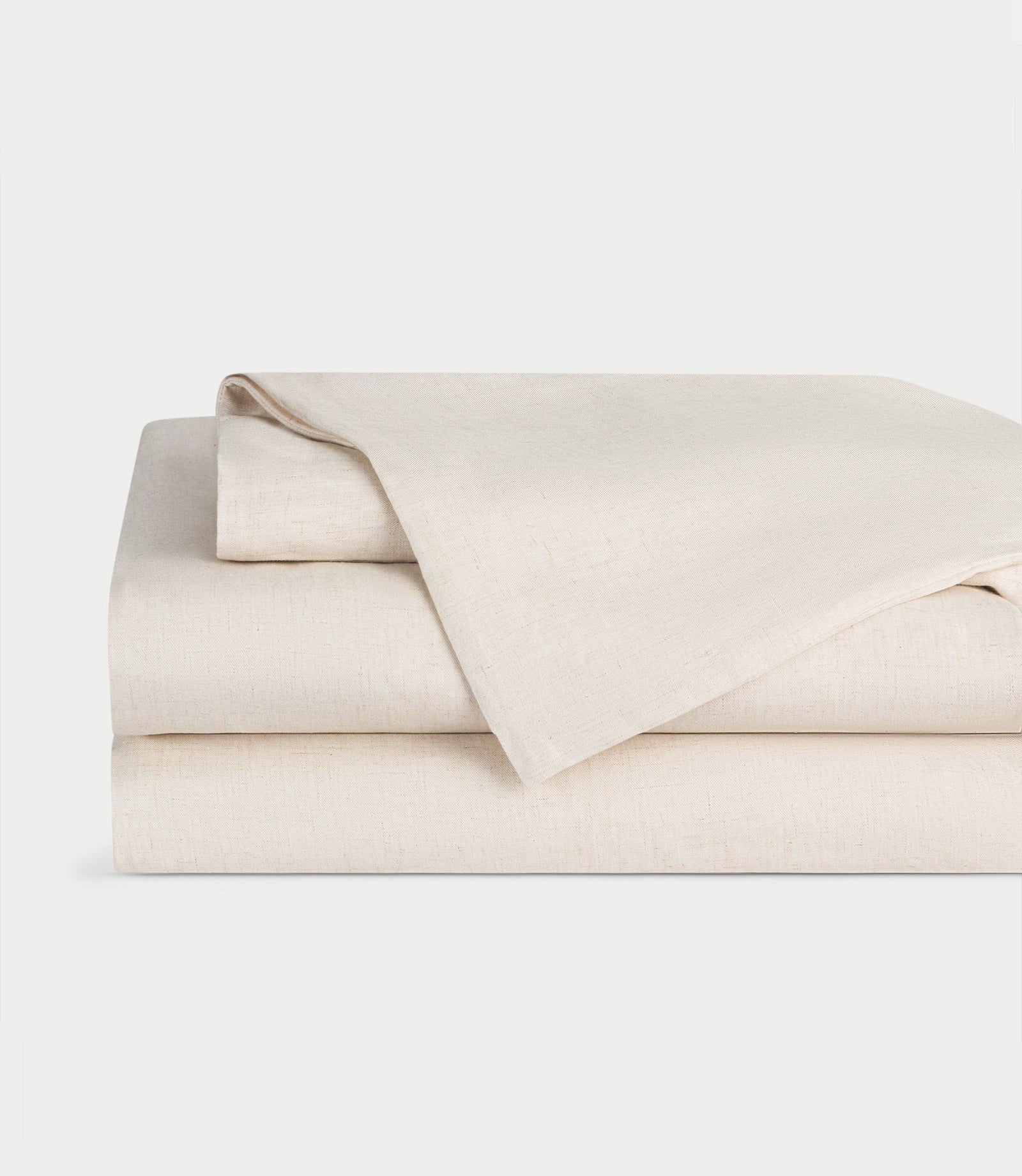 Natural Bamboo Linen Sheet Set neatly folded over a white background. 