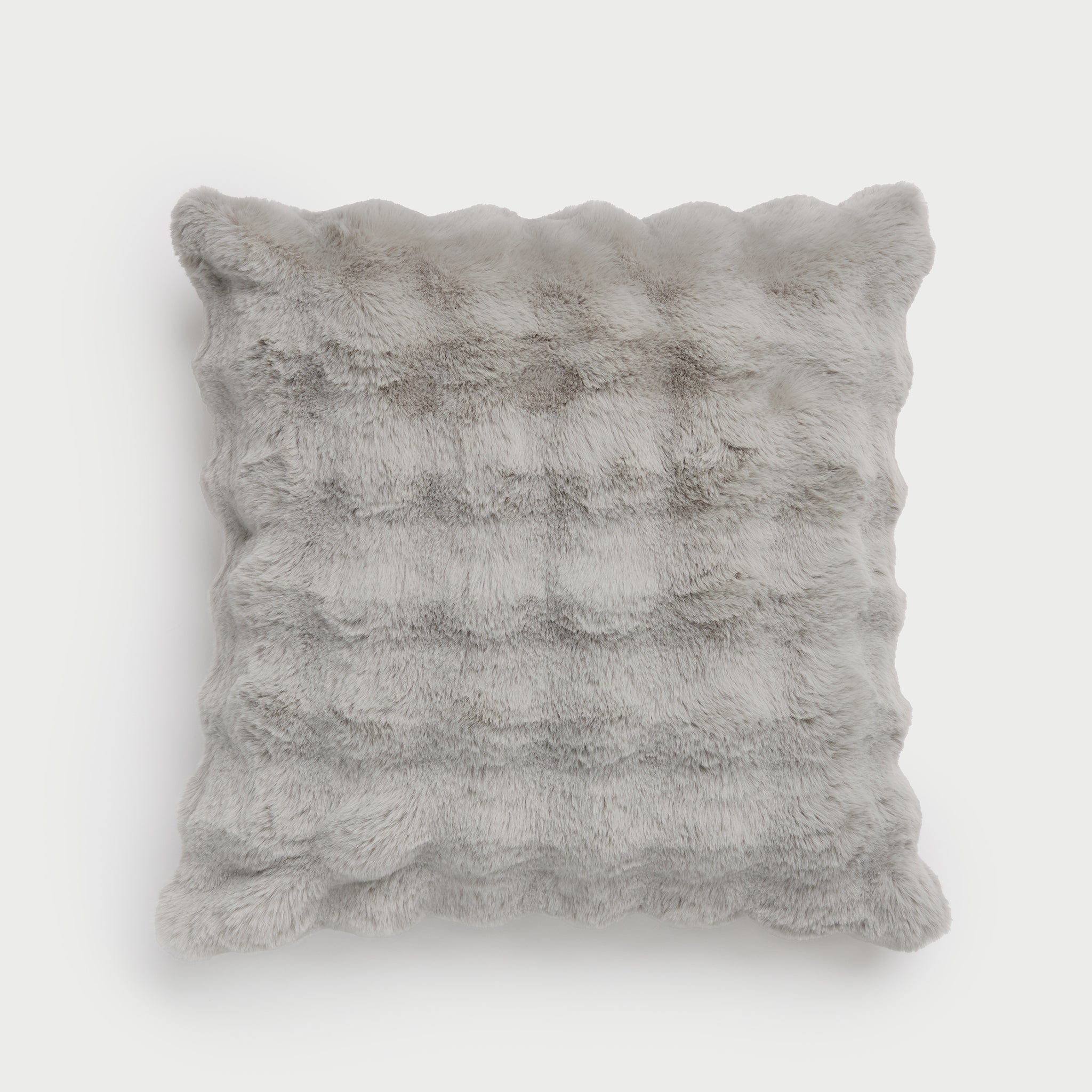 The Bubble Cuddle Pillow by Cozy Earth, featuring a square shape and a wavy, textured surface in grey faux fur, is displayed against a plain white background. |Color:Light Grey