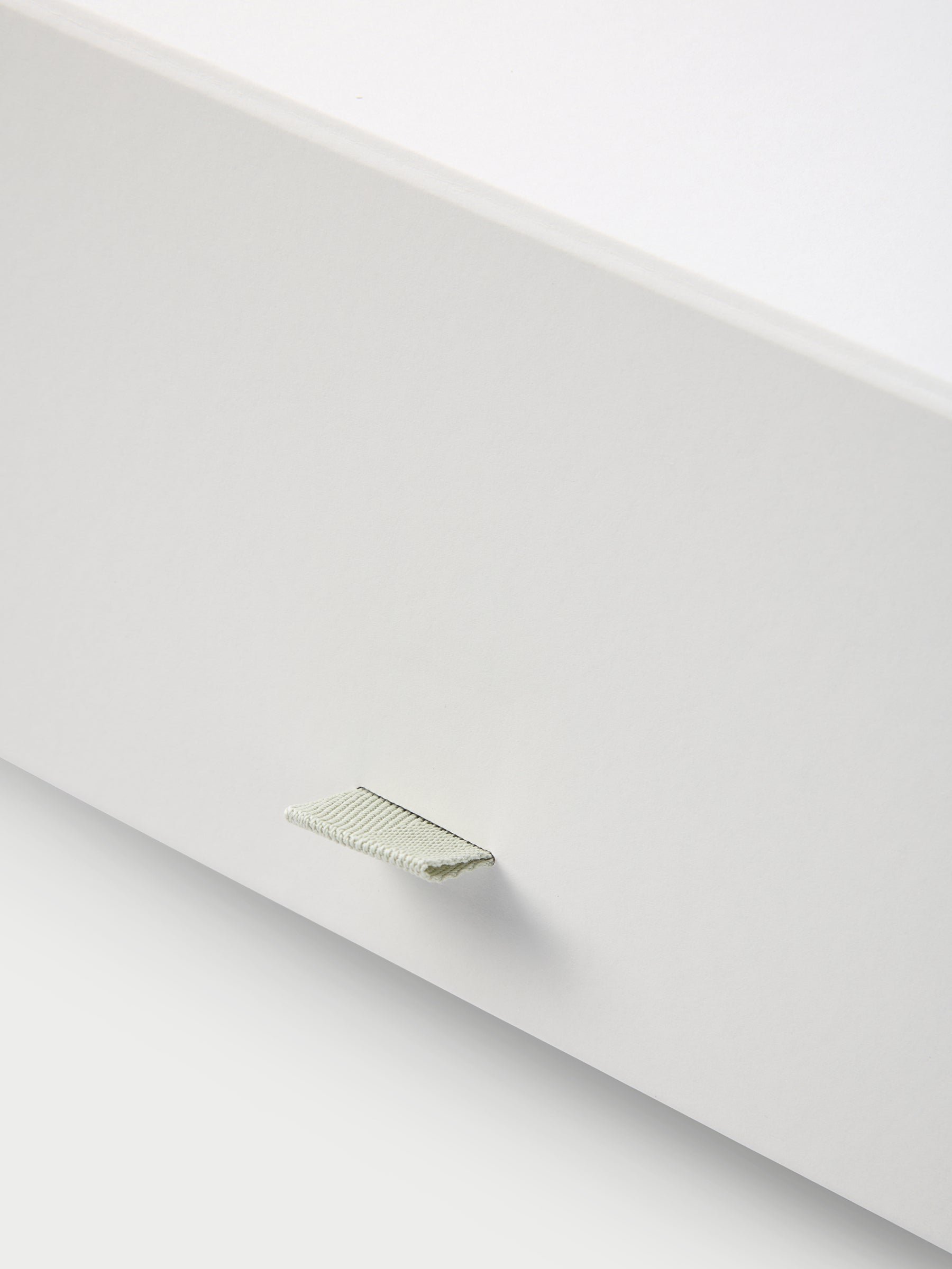 Close up of tab on gift box 