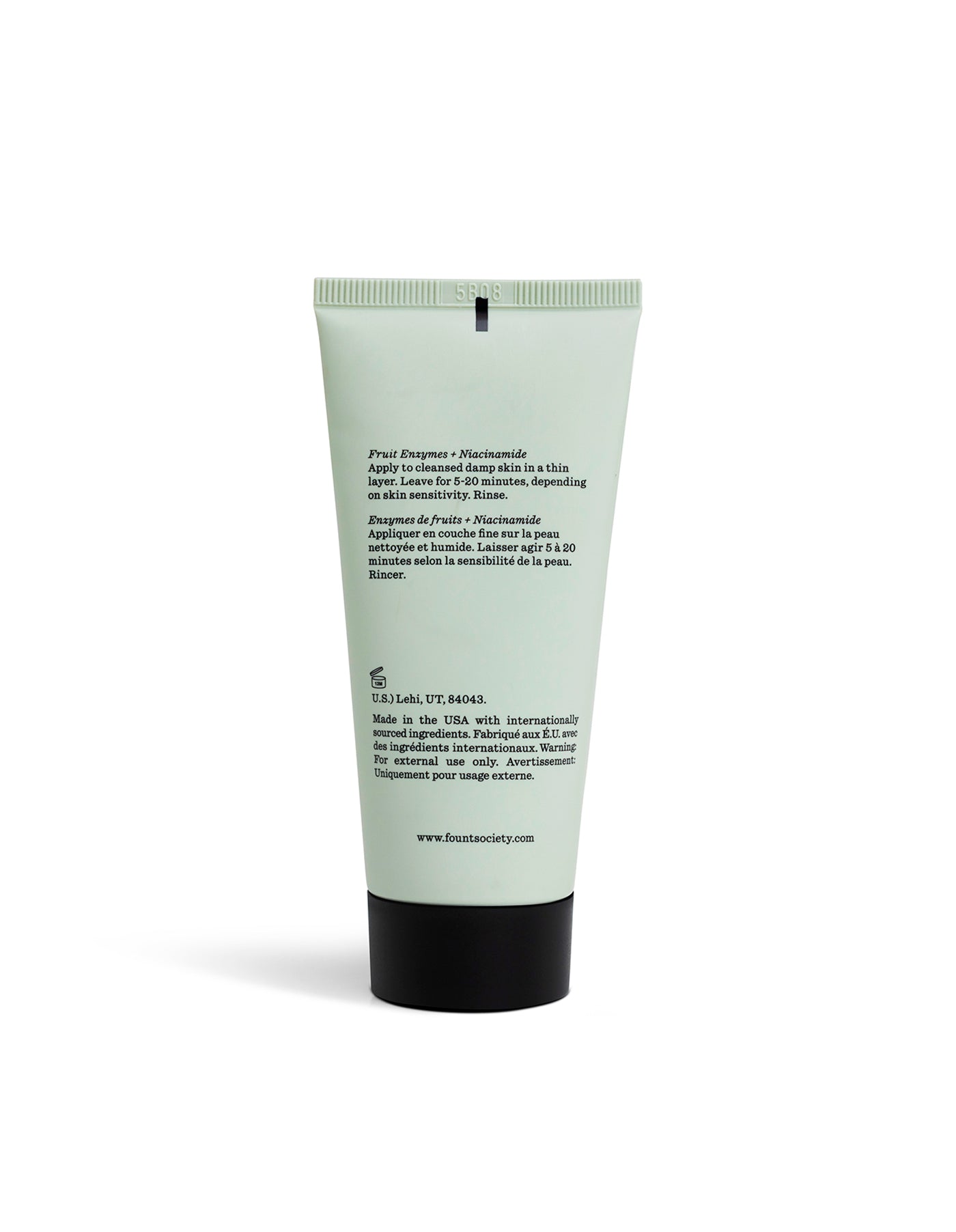 A light green tube of Cozy Earth Enzyme Mask stands upright against a white background, featuring black text on the back with ingredients and usage instructions.|Size:Full Size