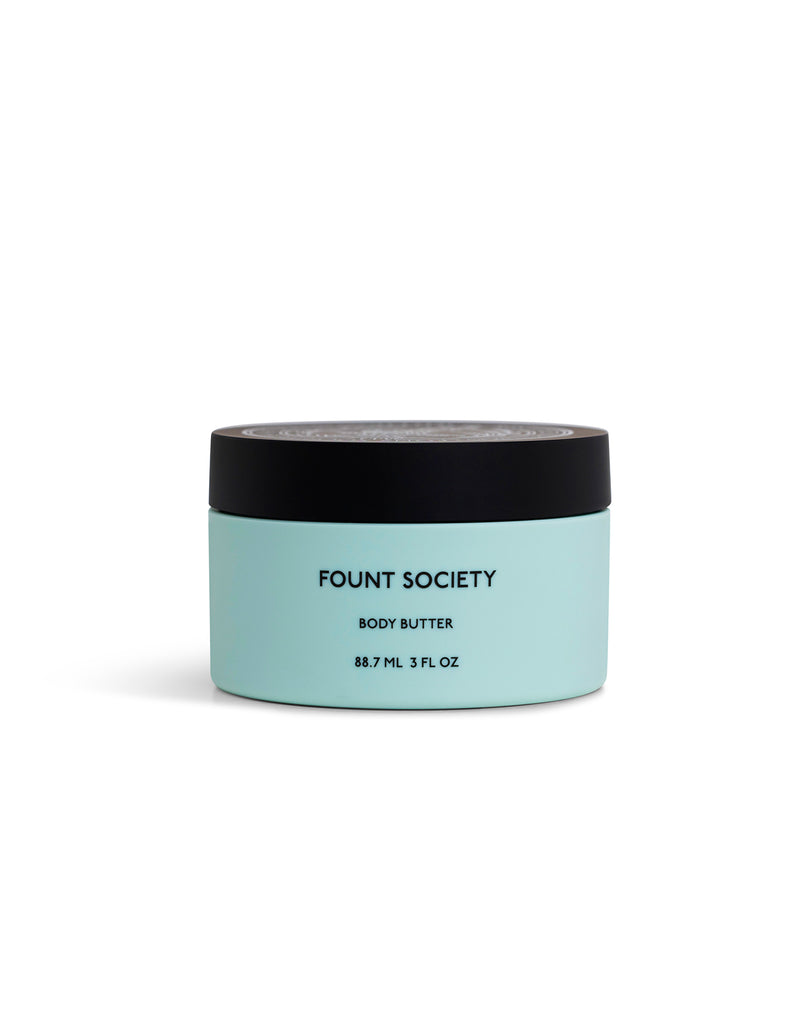 A light blue container with a black lid labeled "Cozy Earth Body Butter, 88.7 mL, 3 fl oz," displayed against a plain white background.