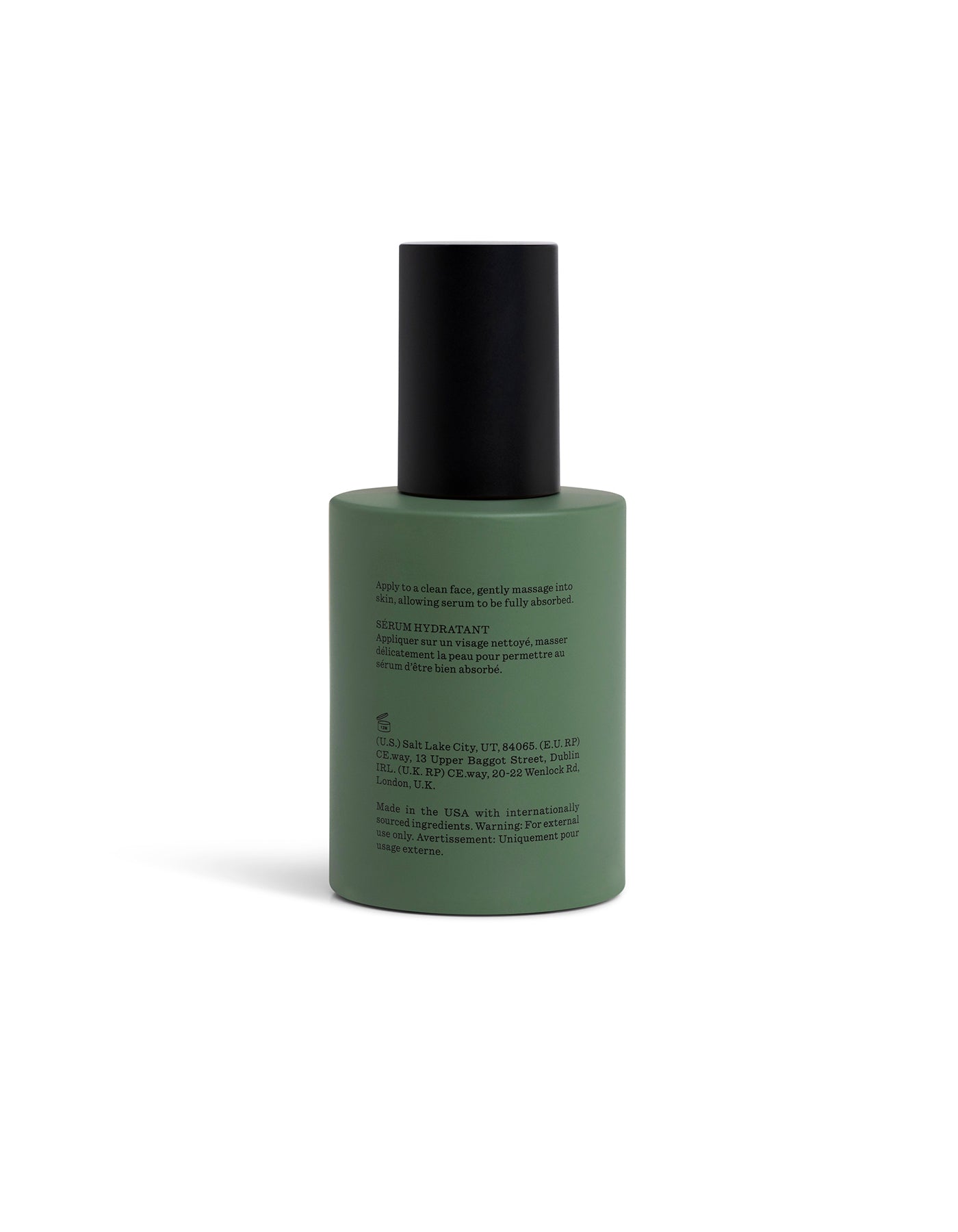 Green Fount Society Body Serum bottle turned backward with black cap on a white background