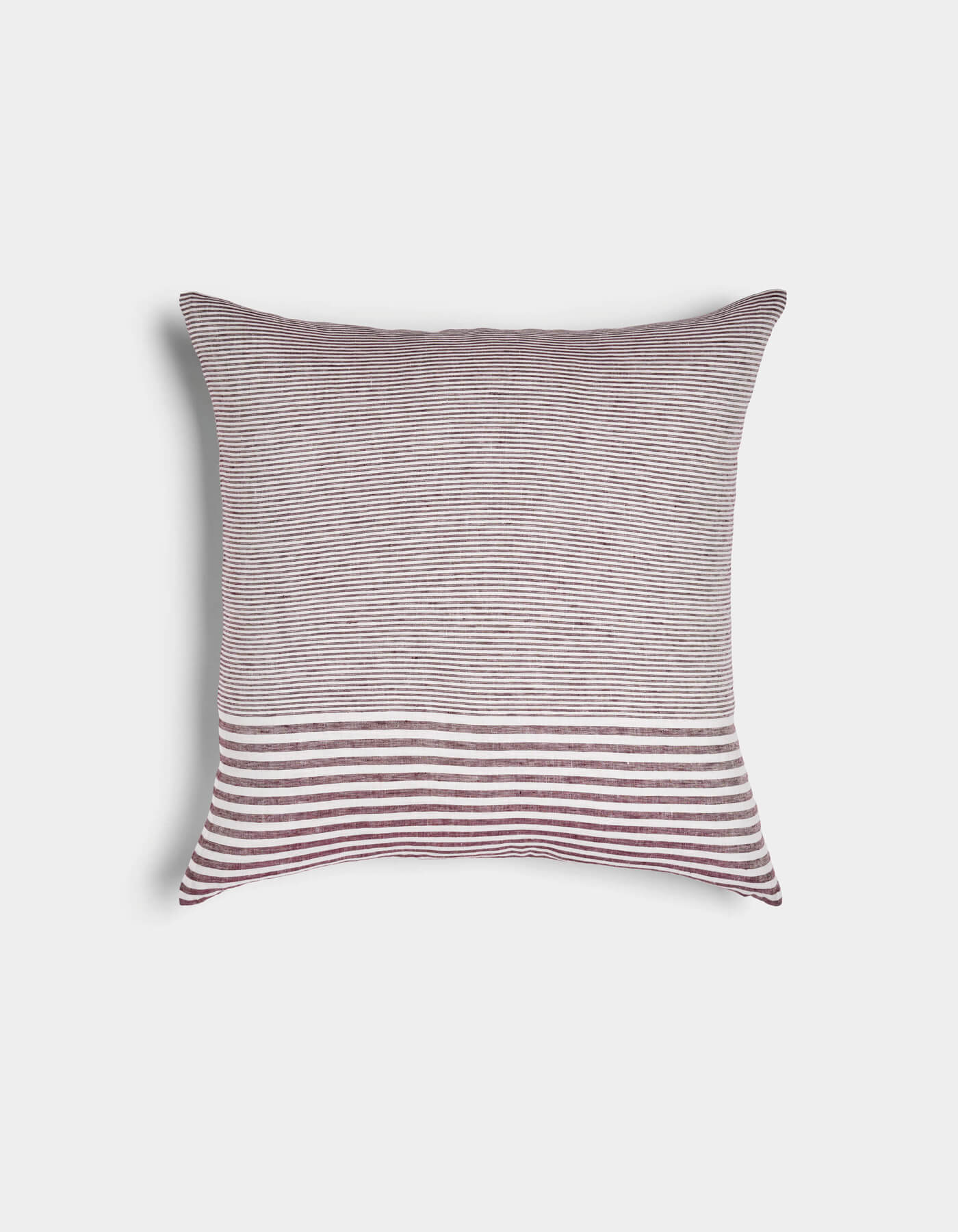 The Cozy Earth Striped Throw Pillow features thin maroon and white stripes on the top two-thirds and wide stripes on the bottom third, displayed against a plain white background.