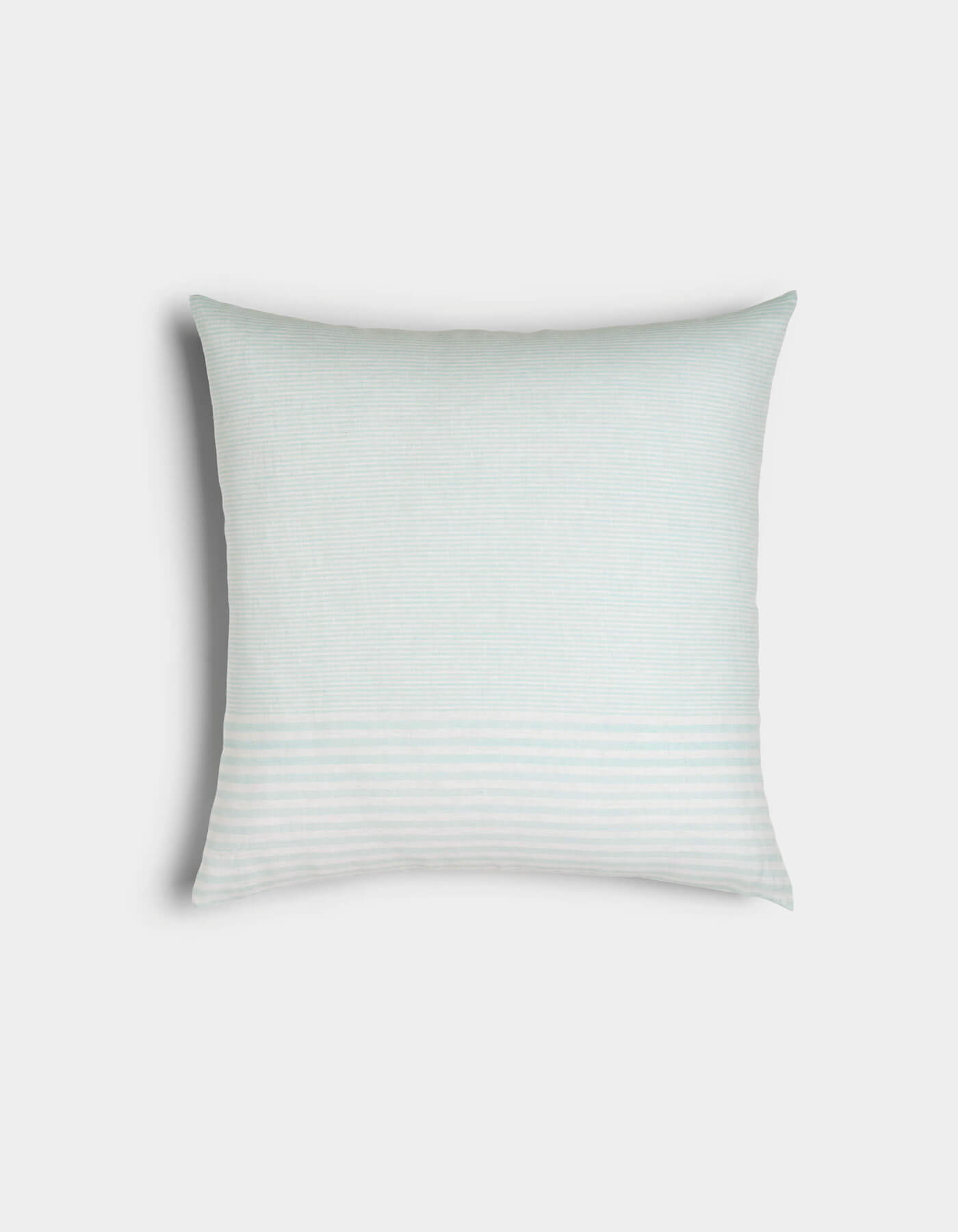The Cozy Earth Striped Throw Pillow is a square white pillow featuring subtle horizontal light gray stripes, displayed against a plain light background.
