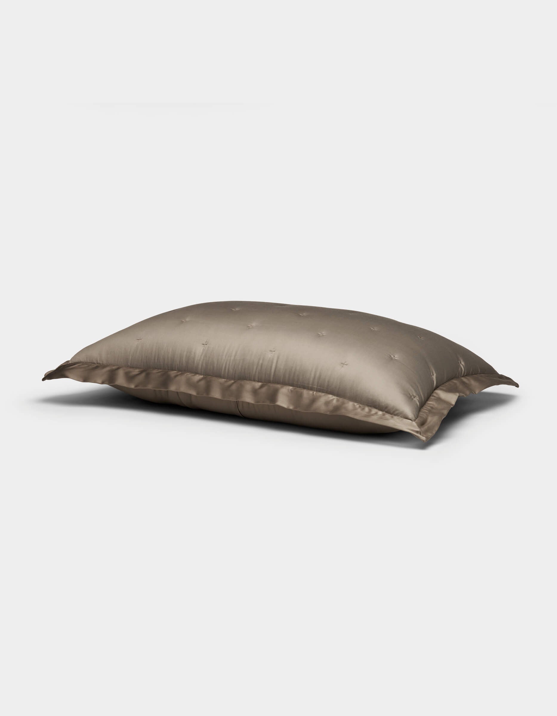 The Bamboo Quilted Shams by Cozy Earth feature a plush, rectangular design with a smooth, shiny taupe cover and subtle embroidered dots, shown against a plain white background.|Color:Walnut