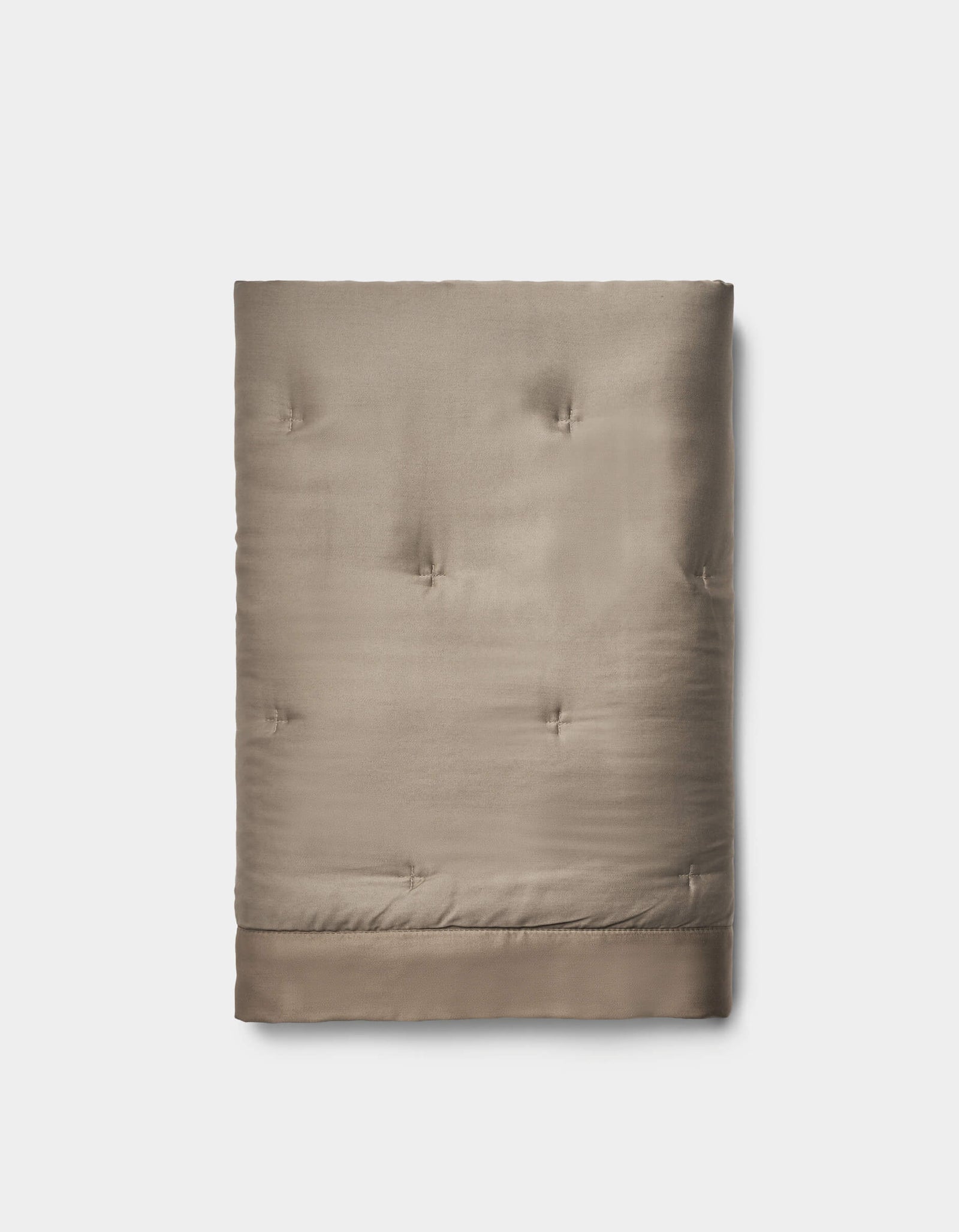 The Bamboo Quilted Shams by Cozy Earth feature a taupe color, quilted design, smooth texture, and subtle tufted stitching, beautifully displayed against a plain white background.