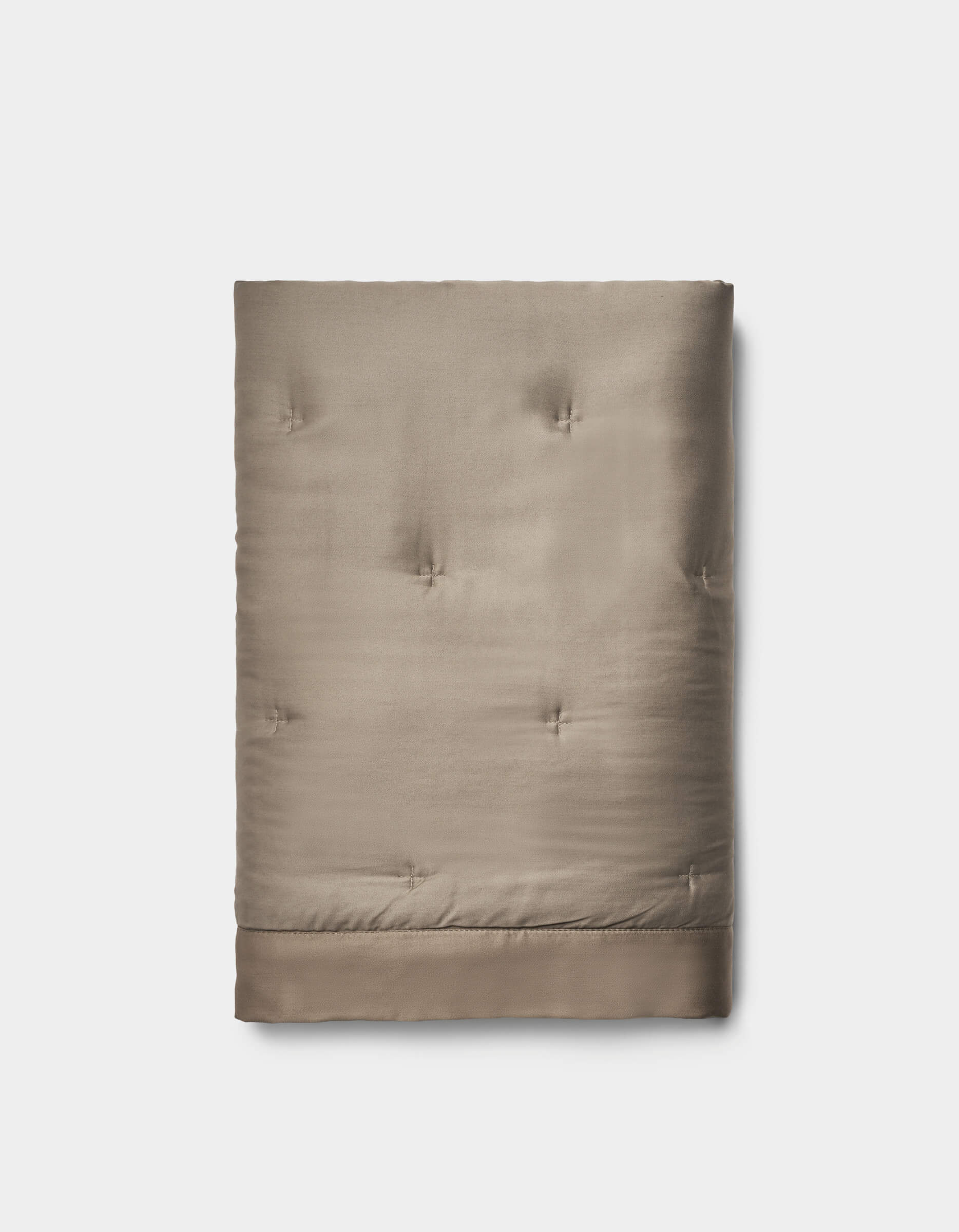 The Bamboo Quilted Shams by Cozy Earth feature a taupe color, quilted design, smooth texture, and subtle tufted stitching, beautifully displayed against a plain white background.