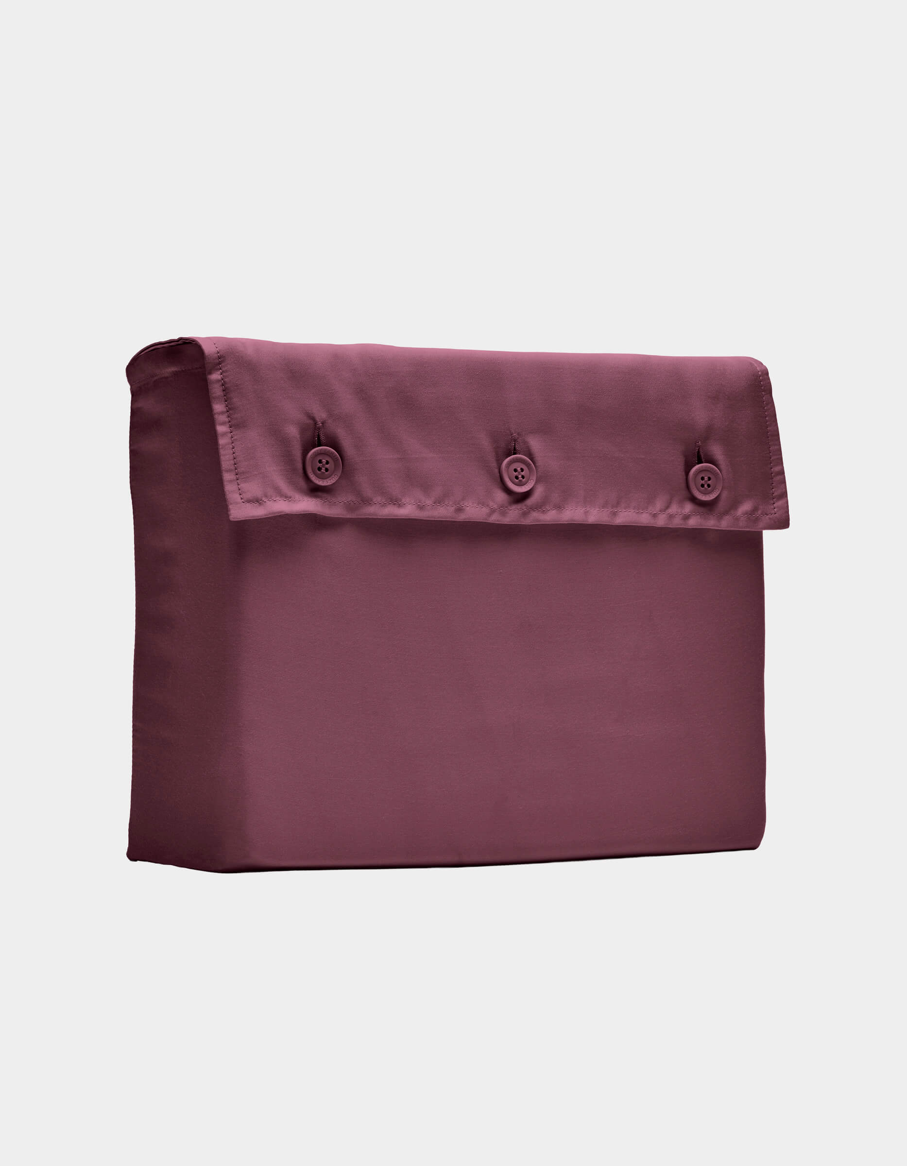 The Cozy Earth Bamboo Sheet Set, shown folded with a buttoned flap in mauve, is displayed against a plain white background.|Color:Mulberry