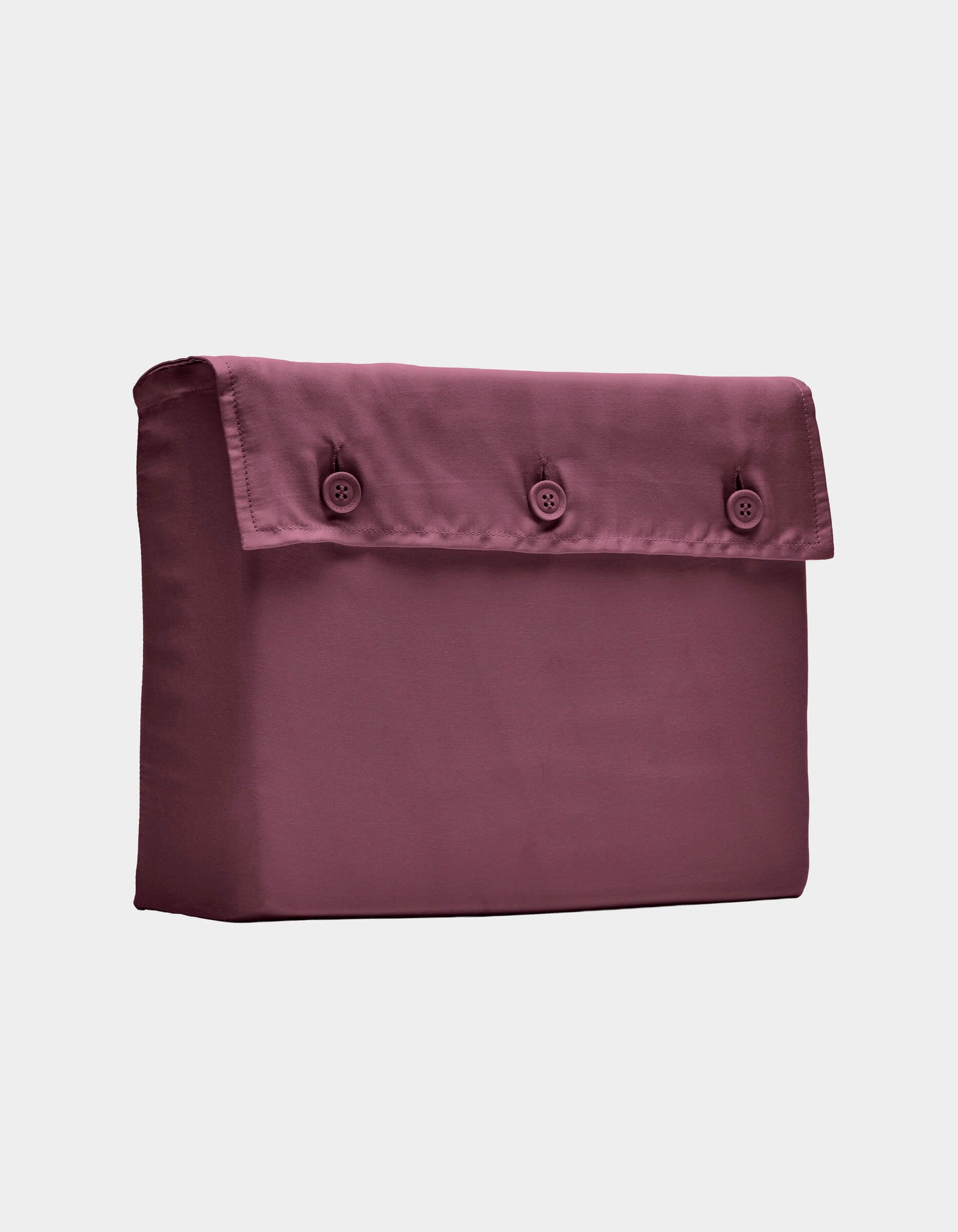 The Cozy Earth Bamboo Sheet Set, shown folded with a buttoned flap in mauve, is displayed against a plain white background.