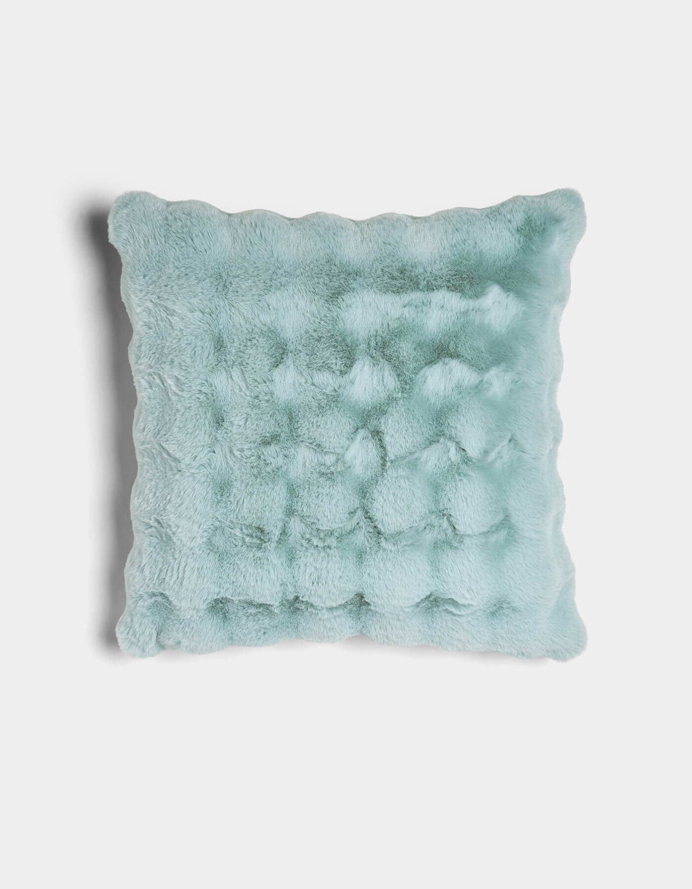 The Cozy Earth Bubble Cuddle Pillow is a square, light blue plush pillow with a soft, fuzzy texture and gently wavy edges, displayed against a plain white background.|Color:Tide |Size:24" x 24"