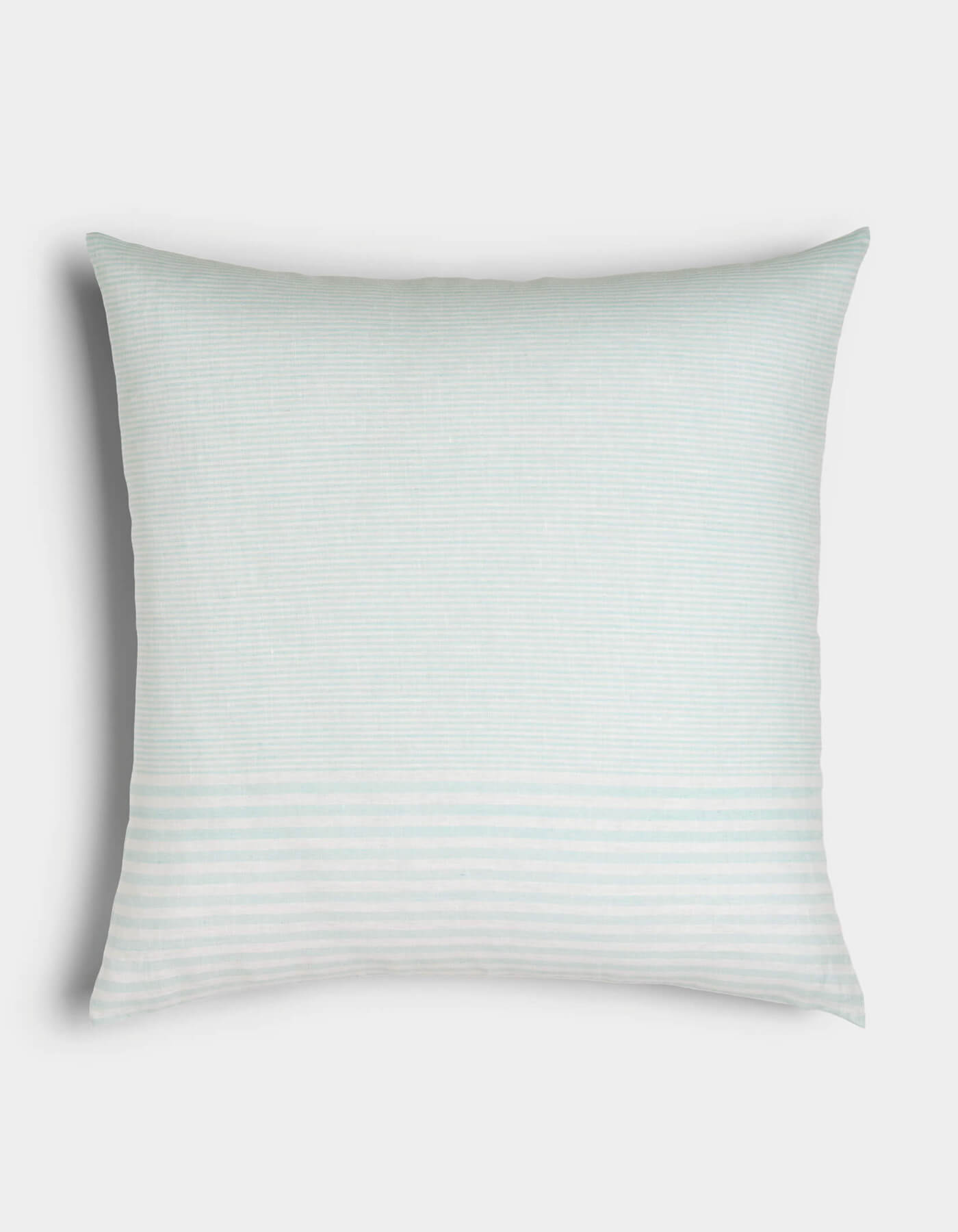 The Cozy Earth Striped Throw Pillow features a rectangular, light blue design with subtle horizontal stripes—thicker at the lower part—set against a plain white background.