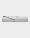 The Cozy Earth Soft-Wash Cotton Flat Sheet in light green is neatly folded and displayed against a plain white background.|Color:Laurel