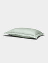 The Soft-Wash Cotton Quilted Shams by Cozy Earth feature a light blue rectangular design with a smooth surface, displayed against a plain white background.|Color:Laurel