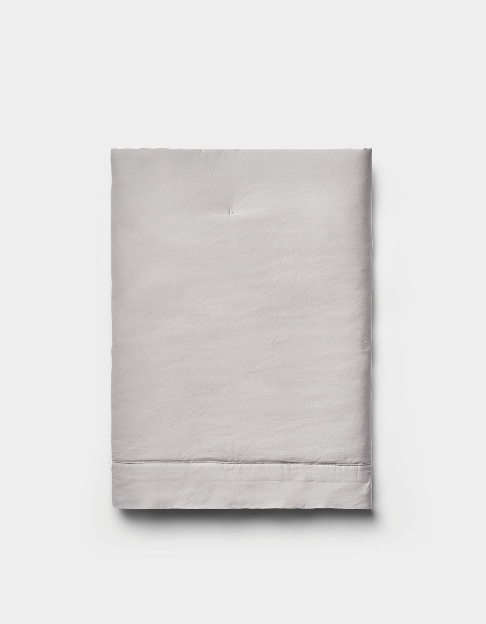 The Cozy Earth Soft-Wash Cotton Quilted Shams are shown neatly folded in light gray against a plain white background.