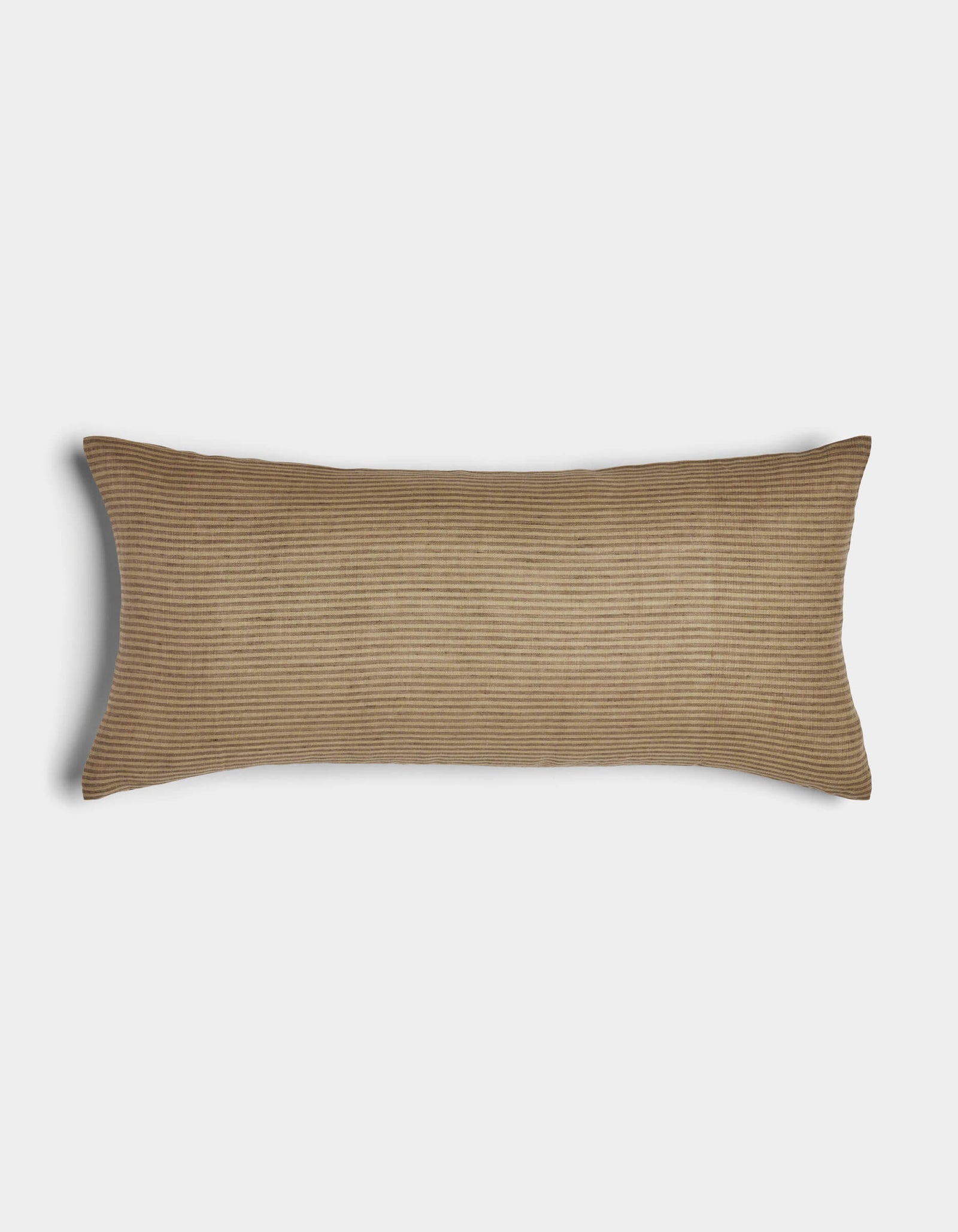 The Cozy Earth Striped Throw Pillow is a long, rectangular brown cushion with a subtle ribbed texture, shown on a plain white background.
