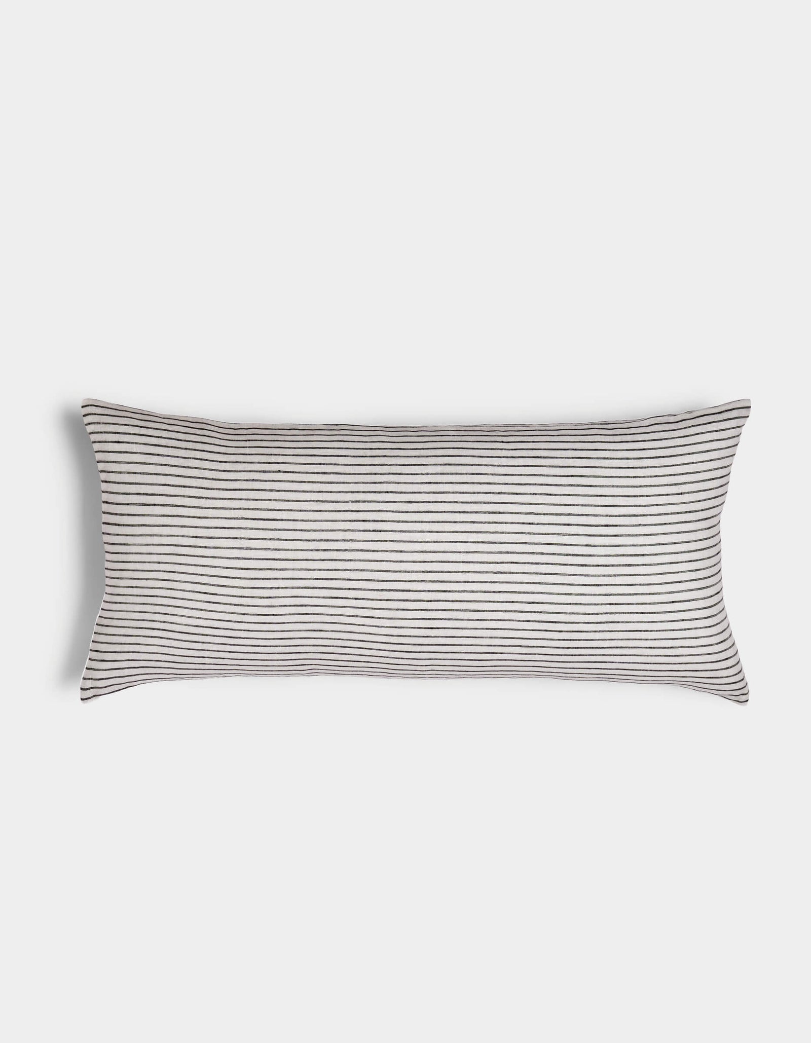 The Cozy Earth Striped Throw Pillow features thin, evenly spaced horizontal black stripes on a white background, displayed against a plain white surface.
