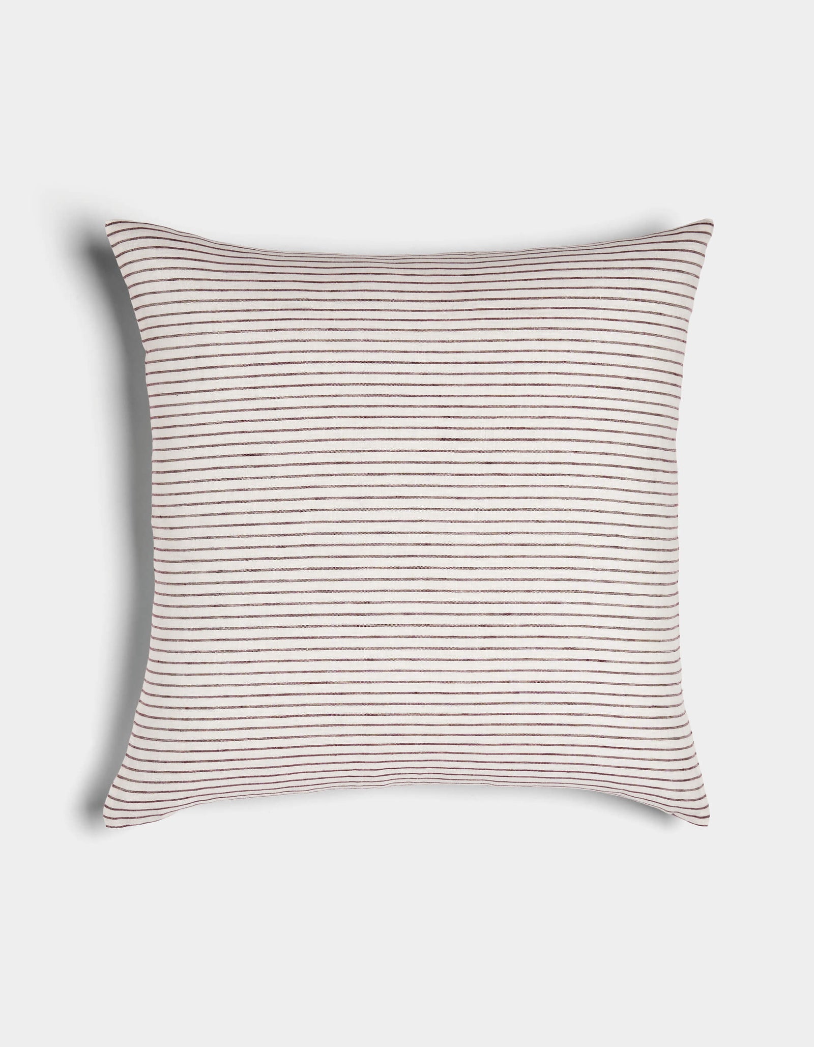The Cozy Earth Striped Throw Pillow features a soft white fabric with thin, evenly spaced horizontal brown stripes and gently curved edges, displayed on a plain white surface.