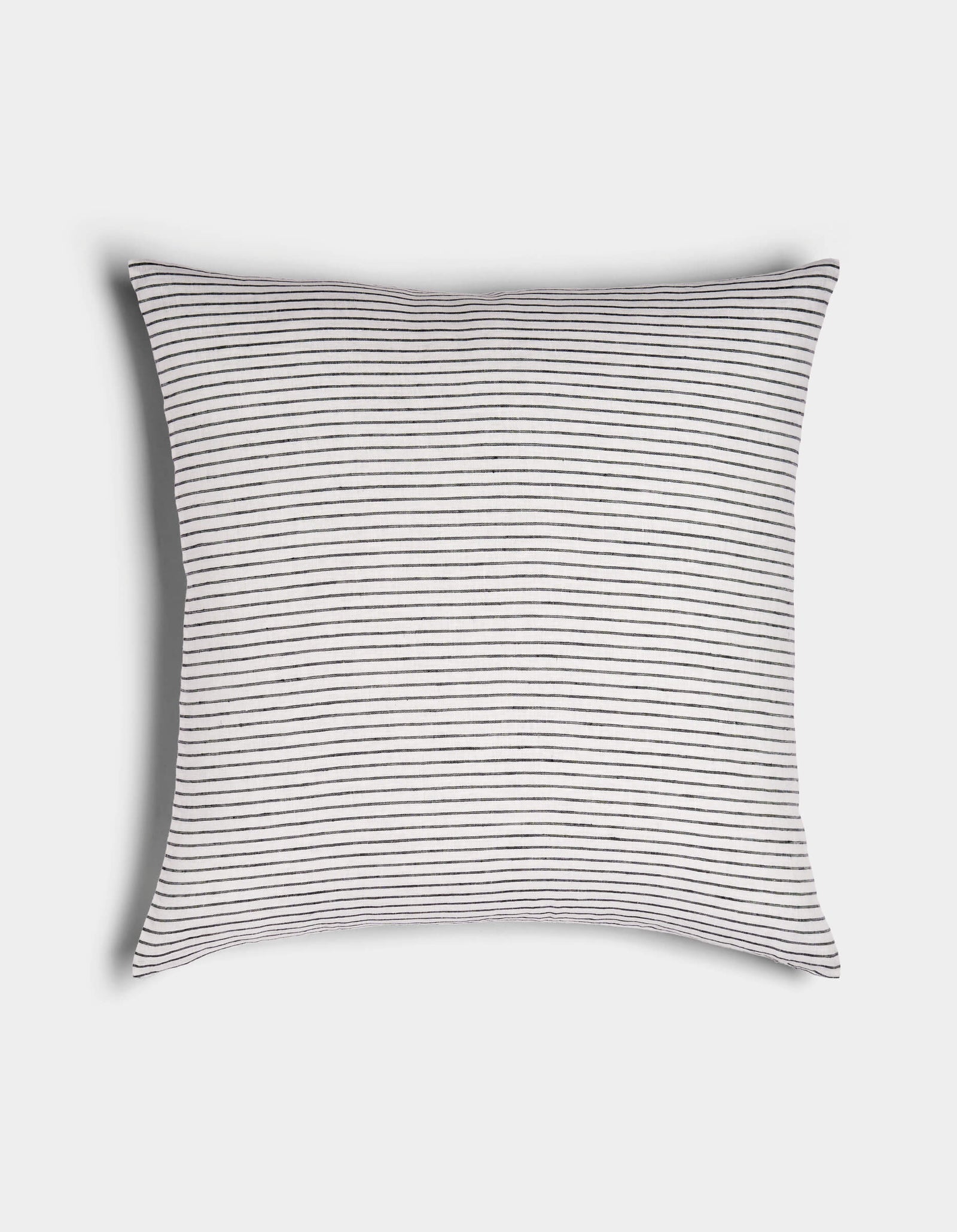 The Striped Throw Pillow by Cozy Earth features a white background with thin, evenly spaced black horizontal stripes, displayed on a plain white surface.