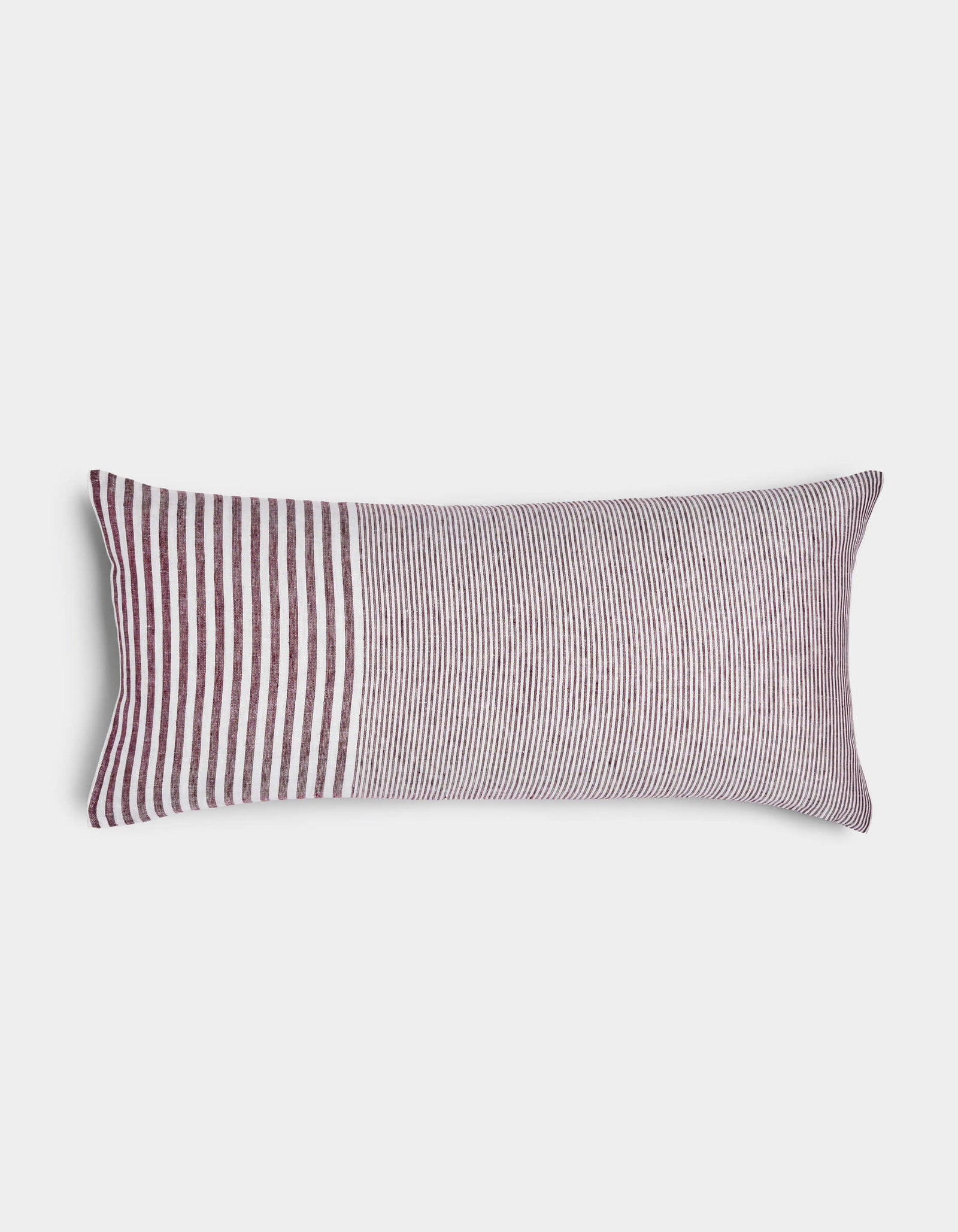 The Striped Throw Pillow by Cozy Earth features a rectangular design with burgundy and white stripes—vertical on the left and closely spaced horizontal stripes on the right.