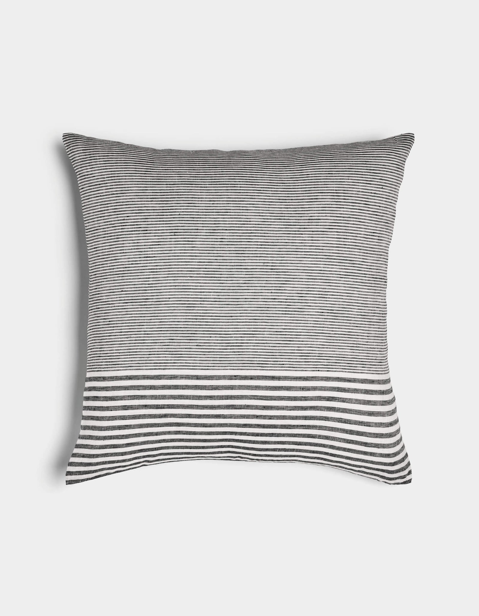 The Cozy Earth Striped Throw Pillow features thin black and white horizontal stripes with a wider striped band near the bottom, displayed on a plain white background.