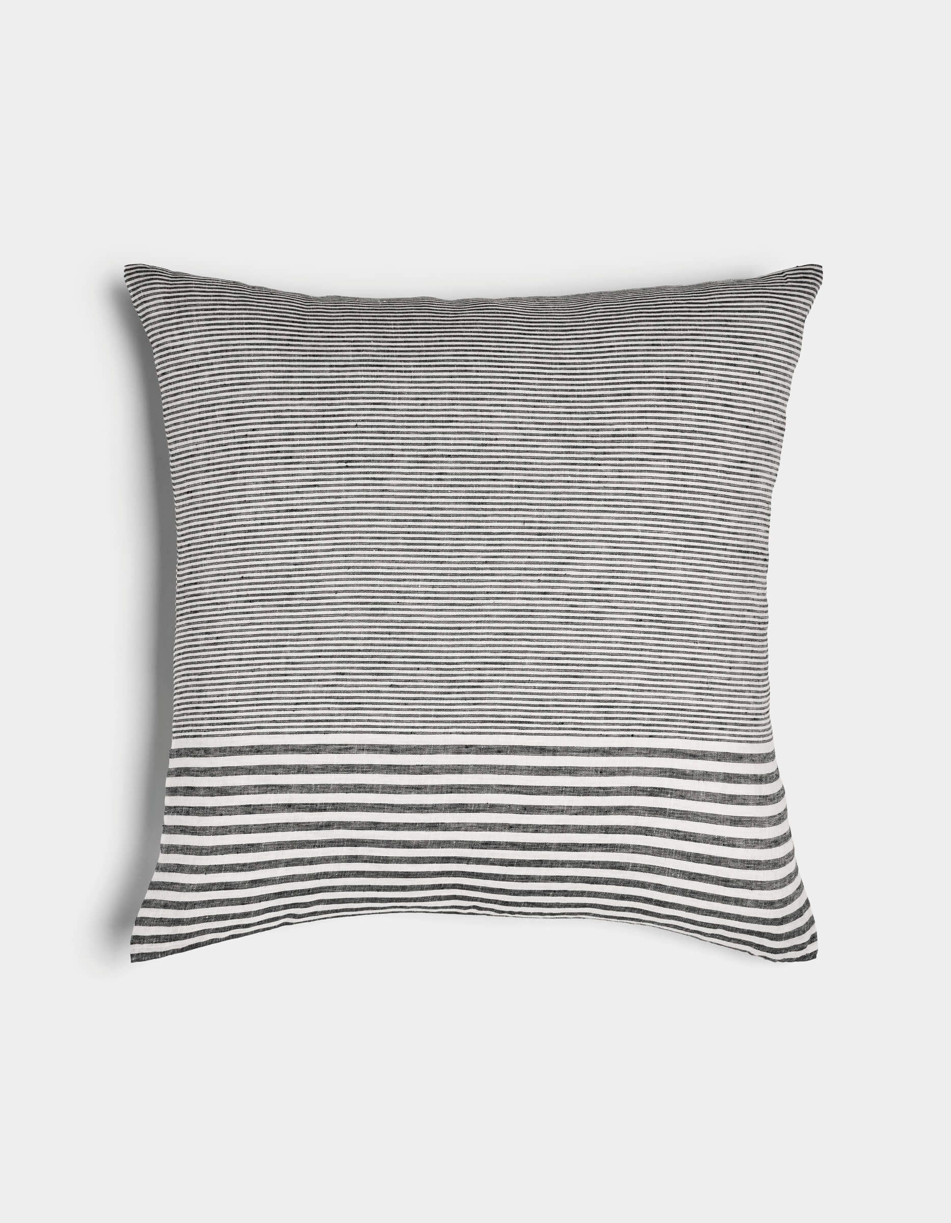 The Cozy Earth Striped Throw Pillow features thin black and white horizontal stripes with a wider striped band near the bottom, displayed on a plain white background.|Color:Mixed Stripe Eclipse and Sea Salt |Size:24" x 24"