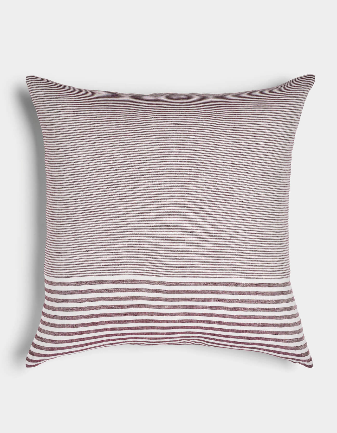 The Cozy Earth Striped Throw Pillow features thin burgundy and white horizontal stripes with a bold band of wider stripes at the bottom, displayed on a white background.