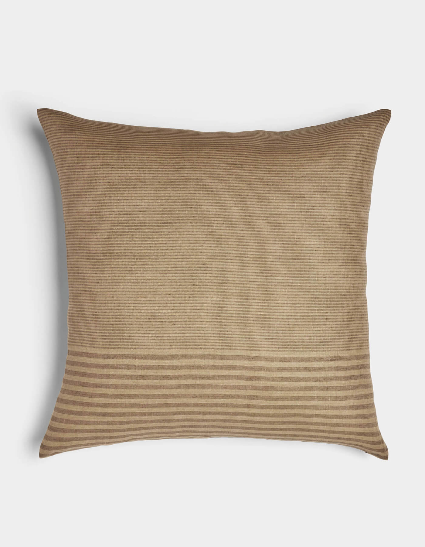 The Striped Throw Pillow by Cozy Earth features a rectangular tan design with a subtle ribbed texture and bold horizontal stripes near the bottom, shown on a white background.