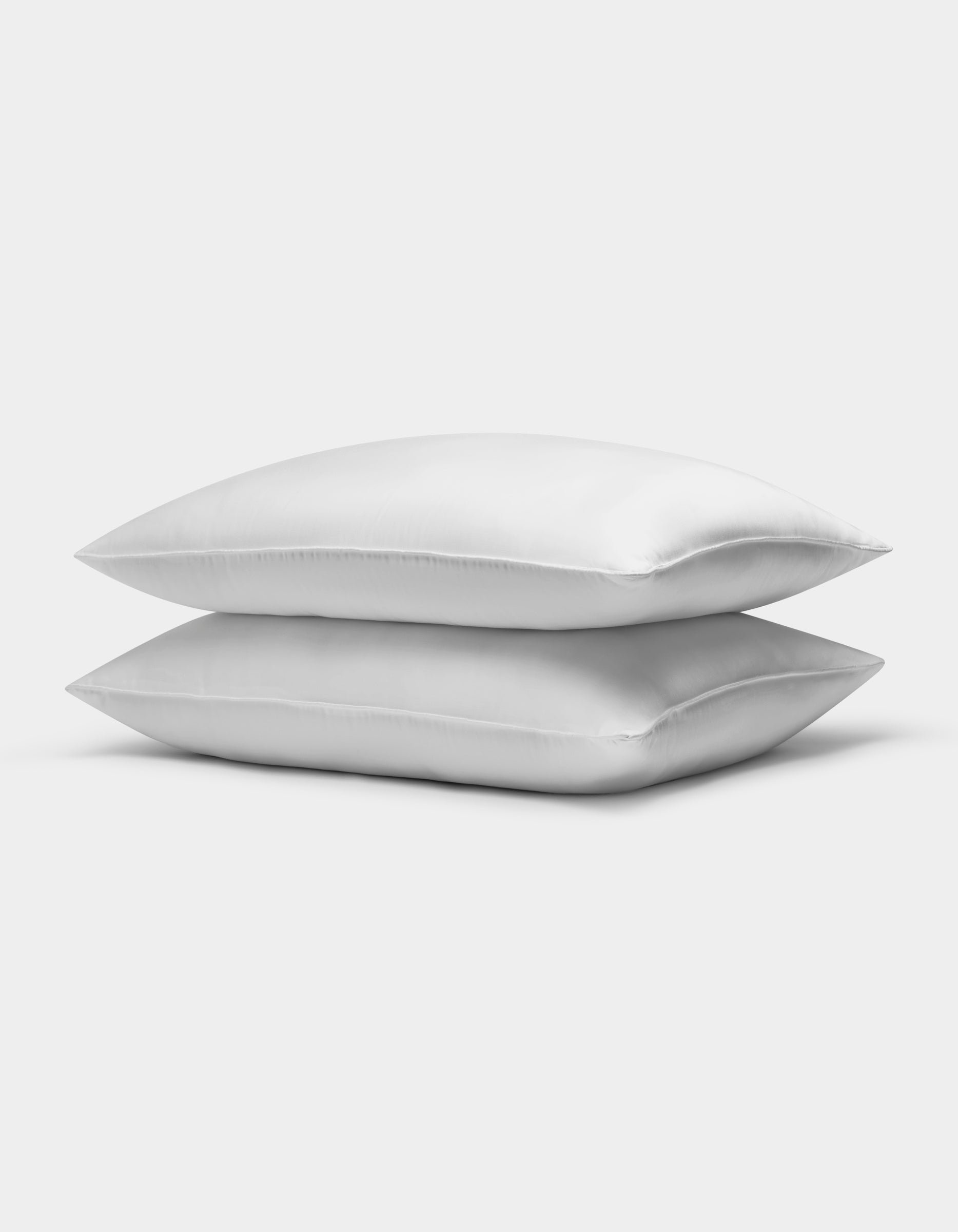 Two Cozy Earth Bamboo Down Alternative Pillows are stacked neatly against a plain white background.Standard King