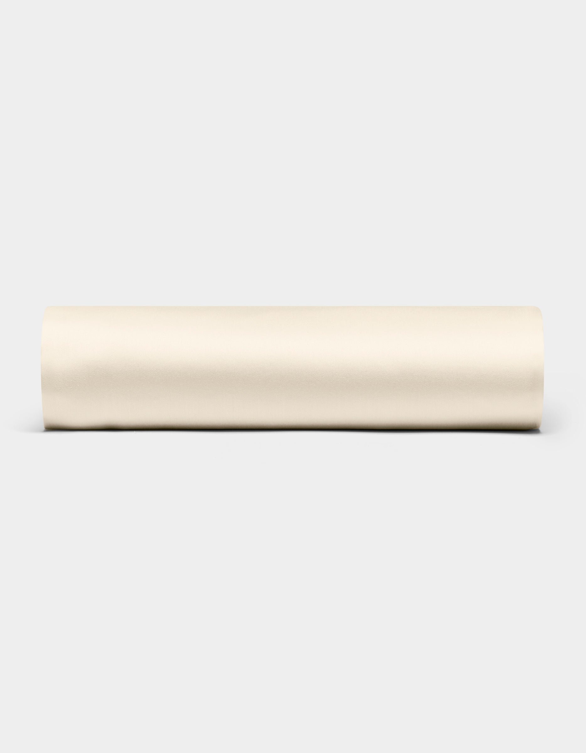 A Bamboo Fitted Sheet by Cozy Earth is displayed horizontally against a plain light gray background.