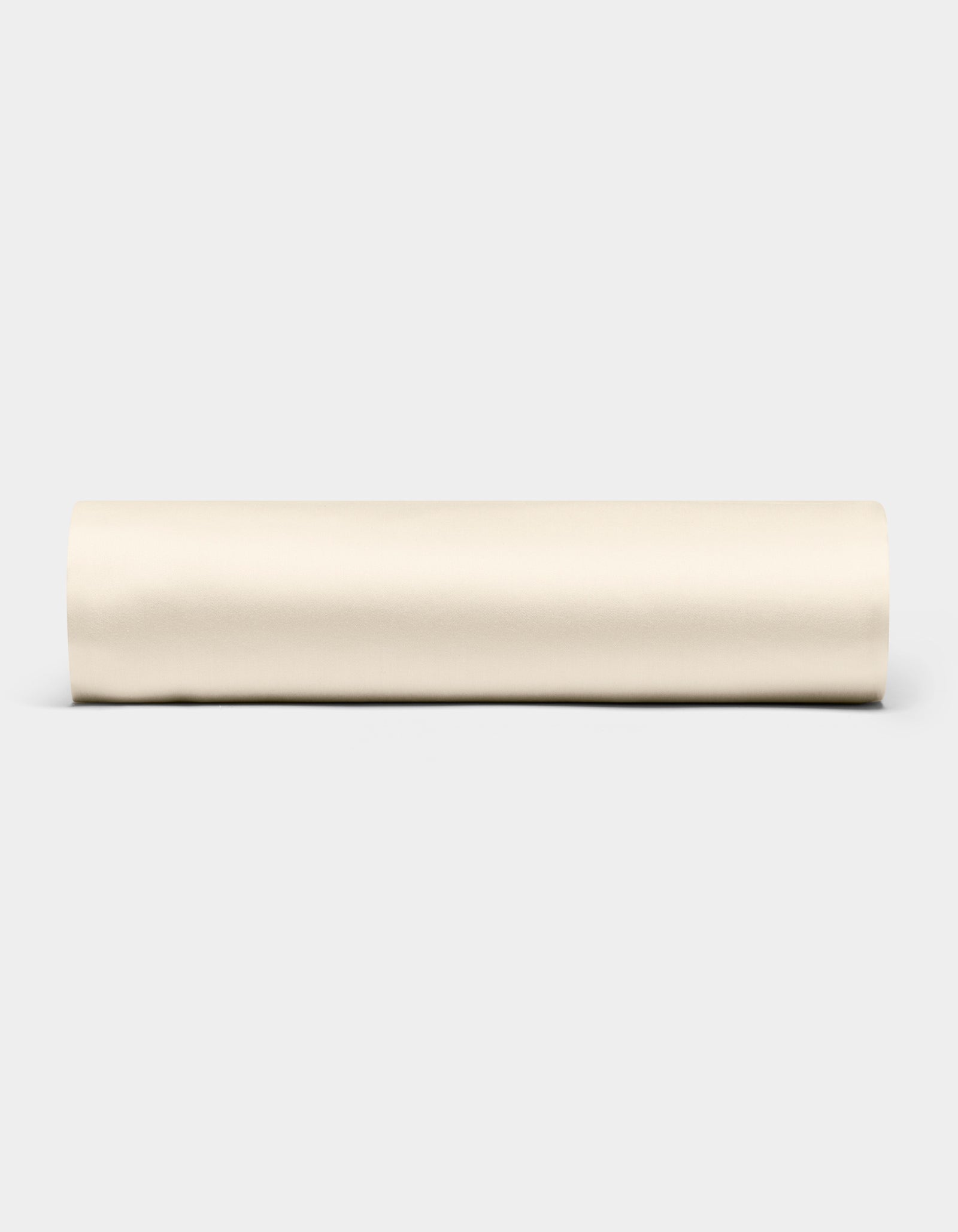 A Bamboo Fitted Sheet by Cozy Earth is displayed horizontally against a plain light gray background.